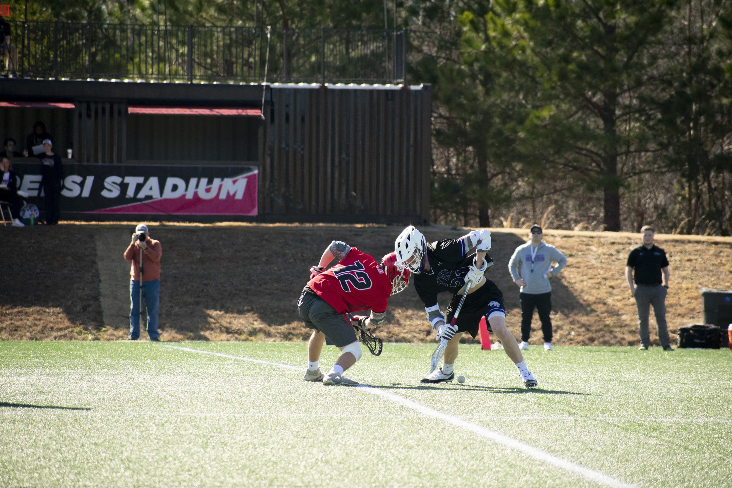 Senior Joe Watson (12) starts the game with a face-off.