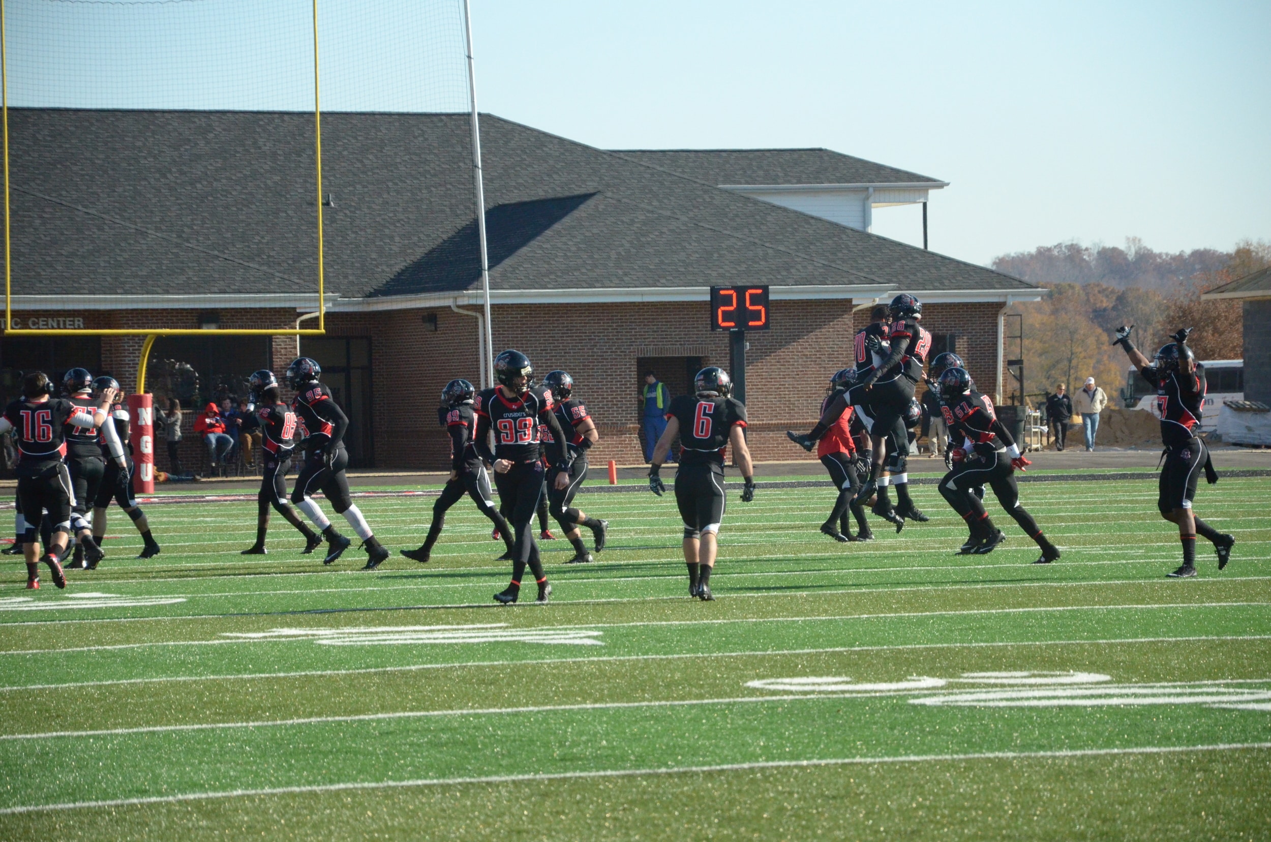  Some excited Crusaders make an exclamatory jump after a successful touchdown. 