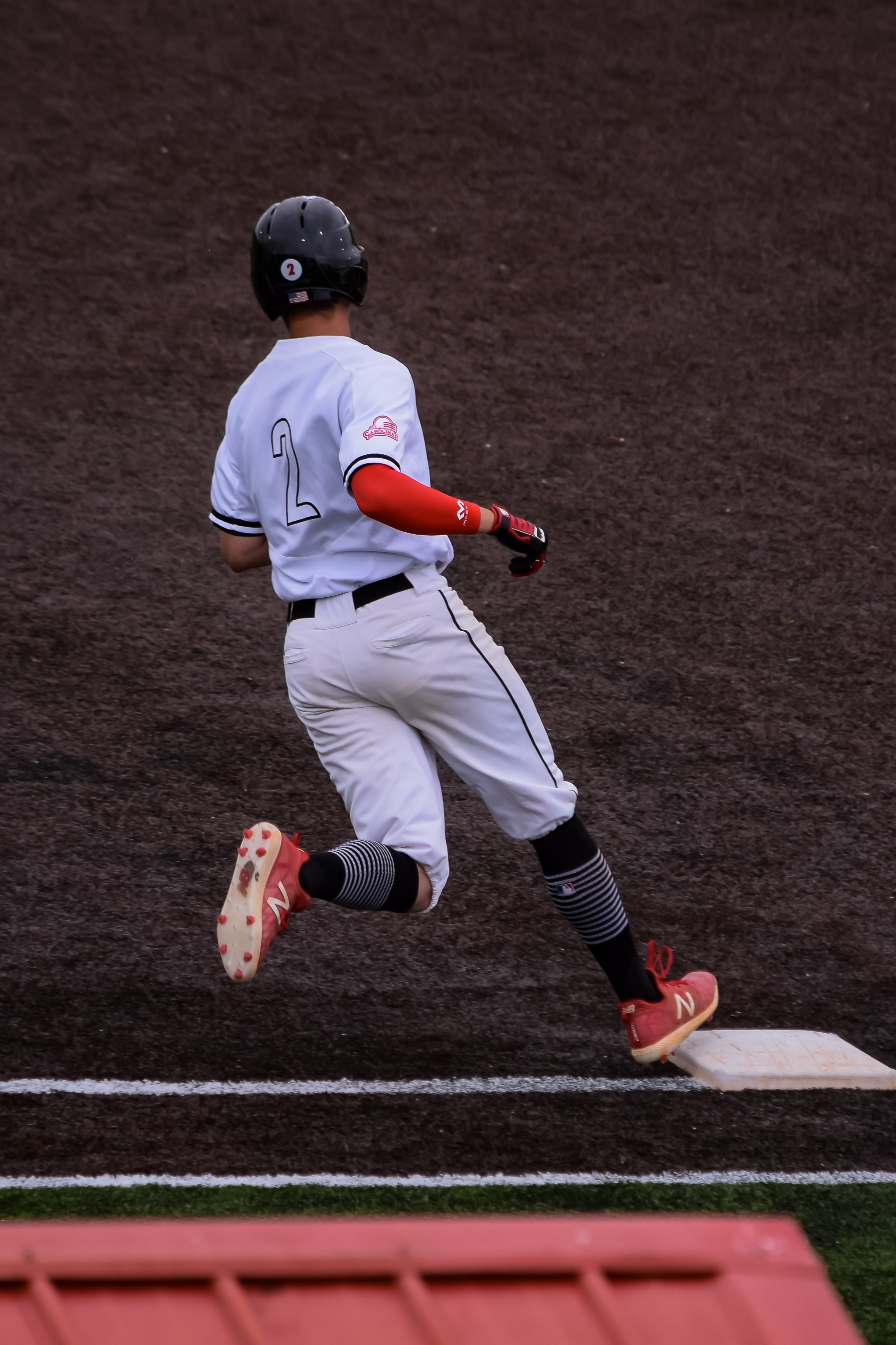 Jones rounds first base as he sees if the opposing team caught the ball.