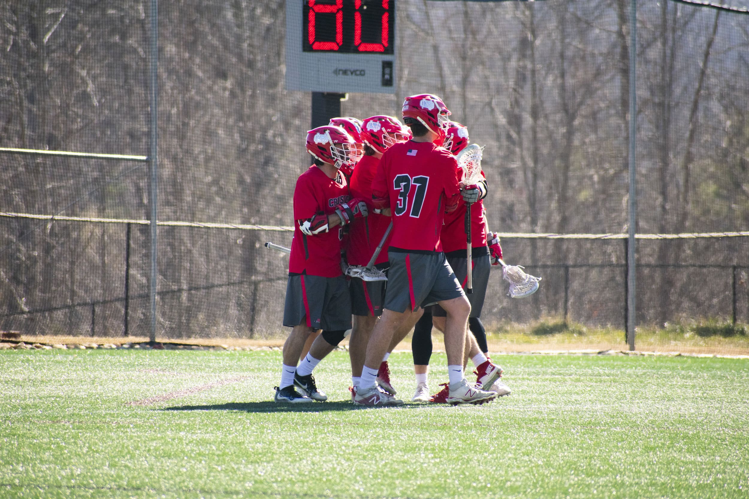 The team celebrates after a teammate scored a point.