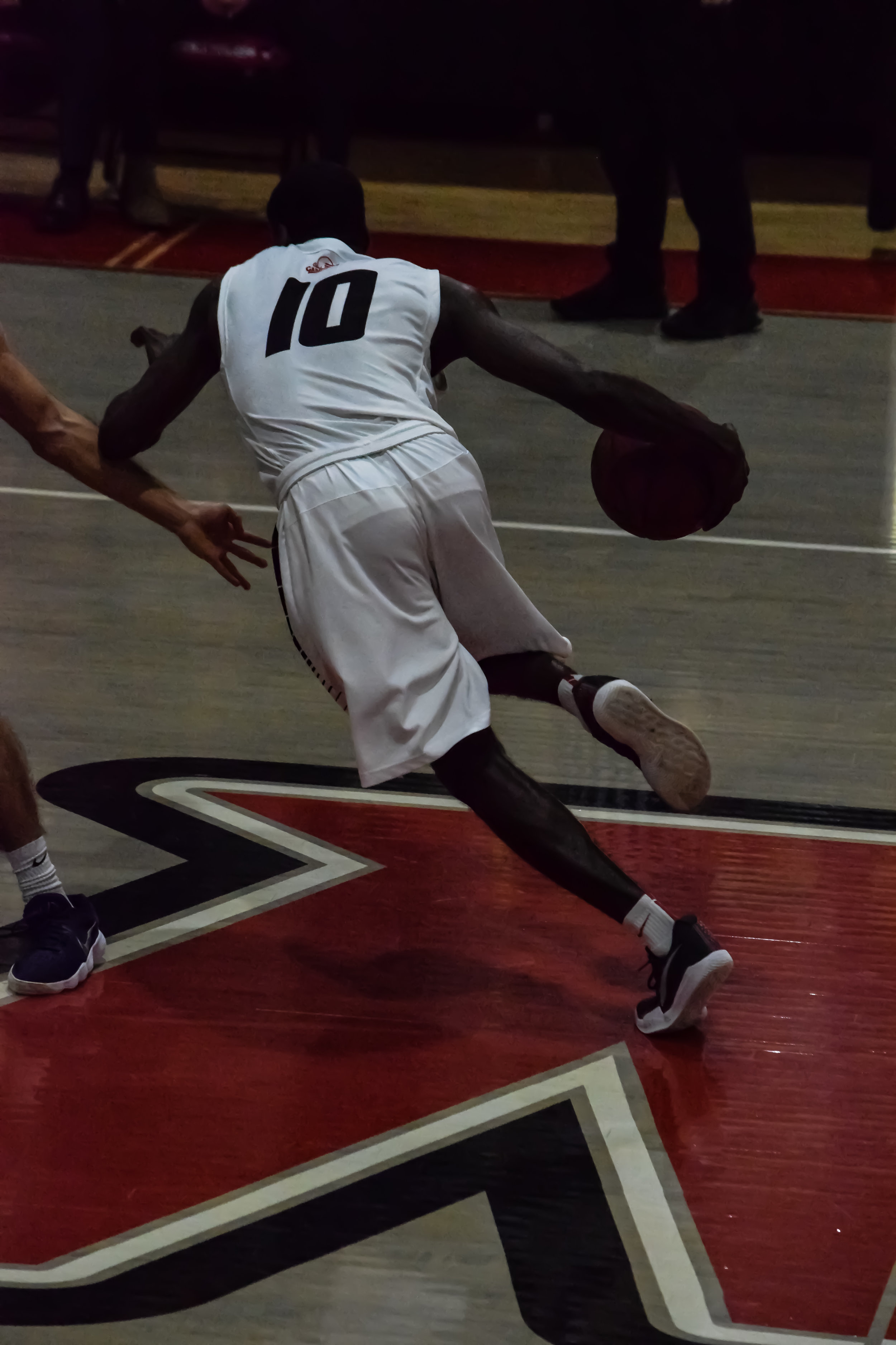 NGU's #10 DJ Brooks races to score another point for the team.