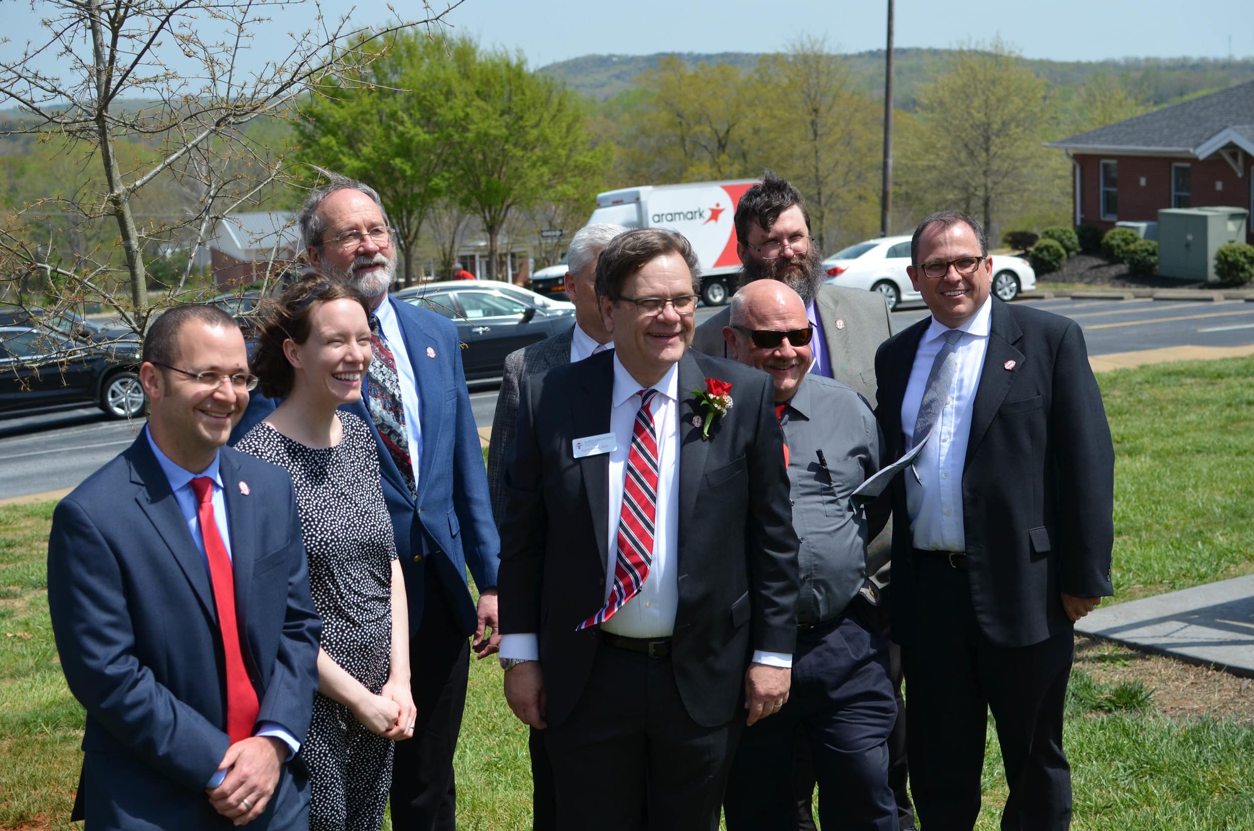 President Gene Fant posing with university professors.