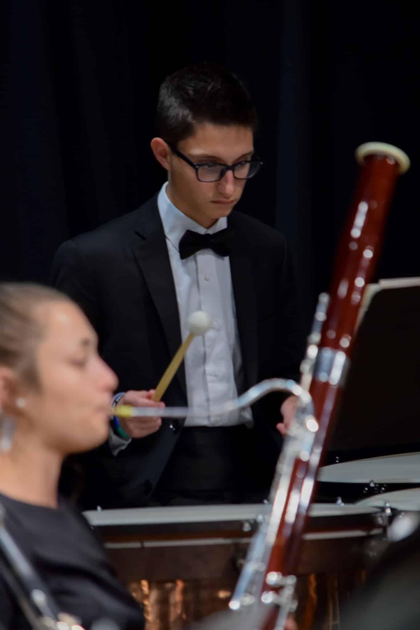Junior, Devon Barnett studies his music carefully in order to come in at the right time.