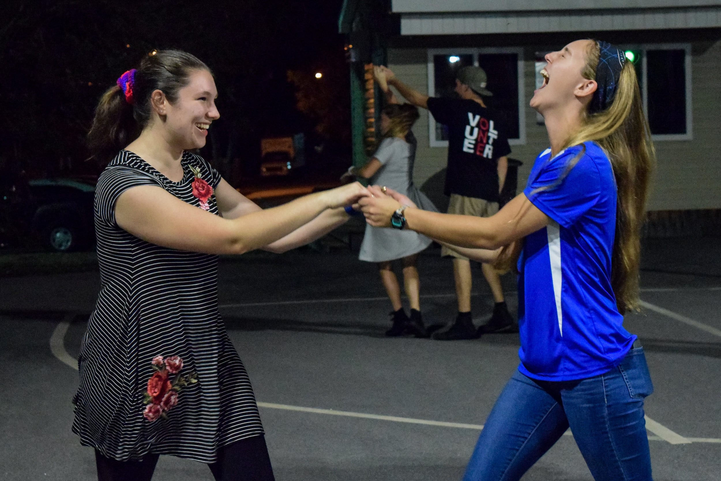 Freshman Sarah Campbell and sophomore Haley Suskin express their joy as they dance together, proving you dont have to have a date to dance.