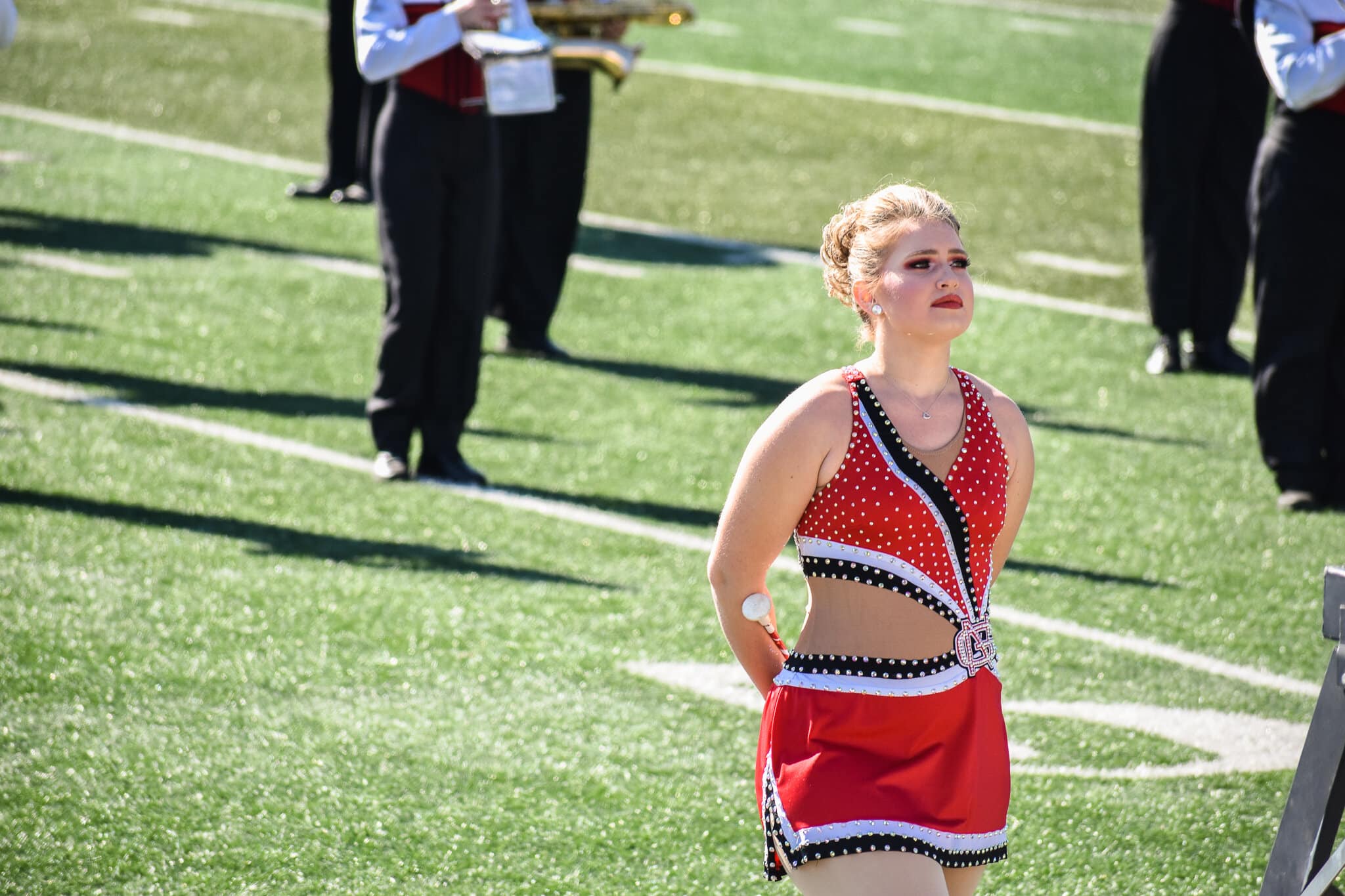 A member of the marching band is silent as the national anthem is played.