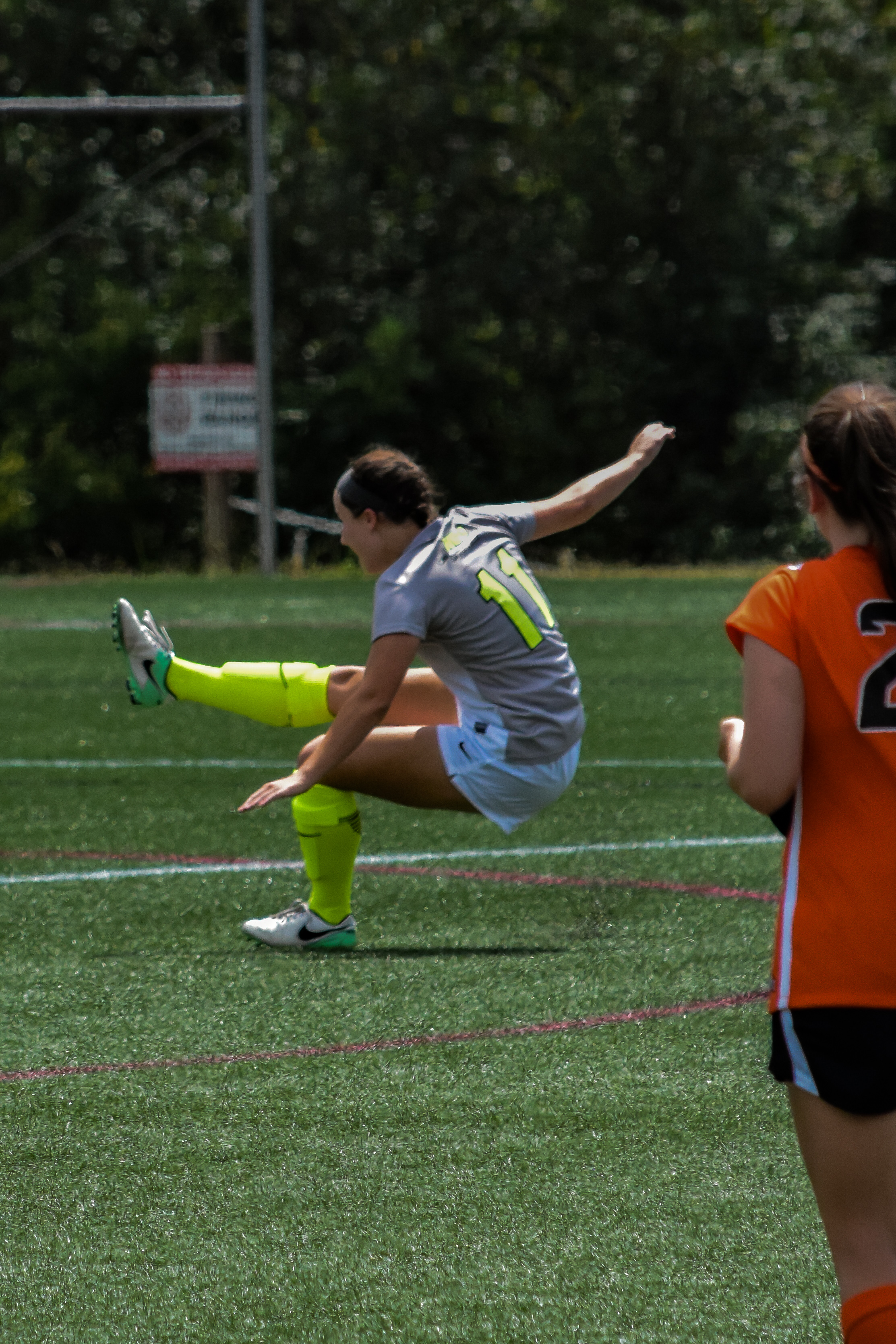 #11 Ayden Boatwright shows off her balancing skills after she kicks the ball.