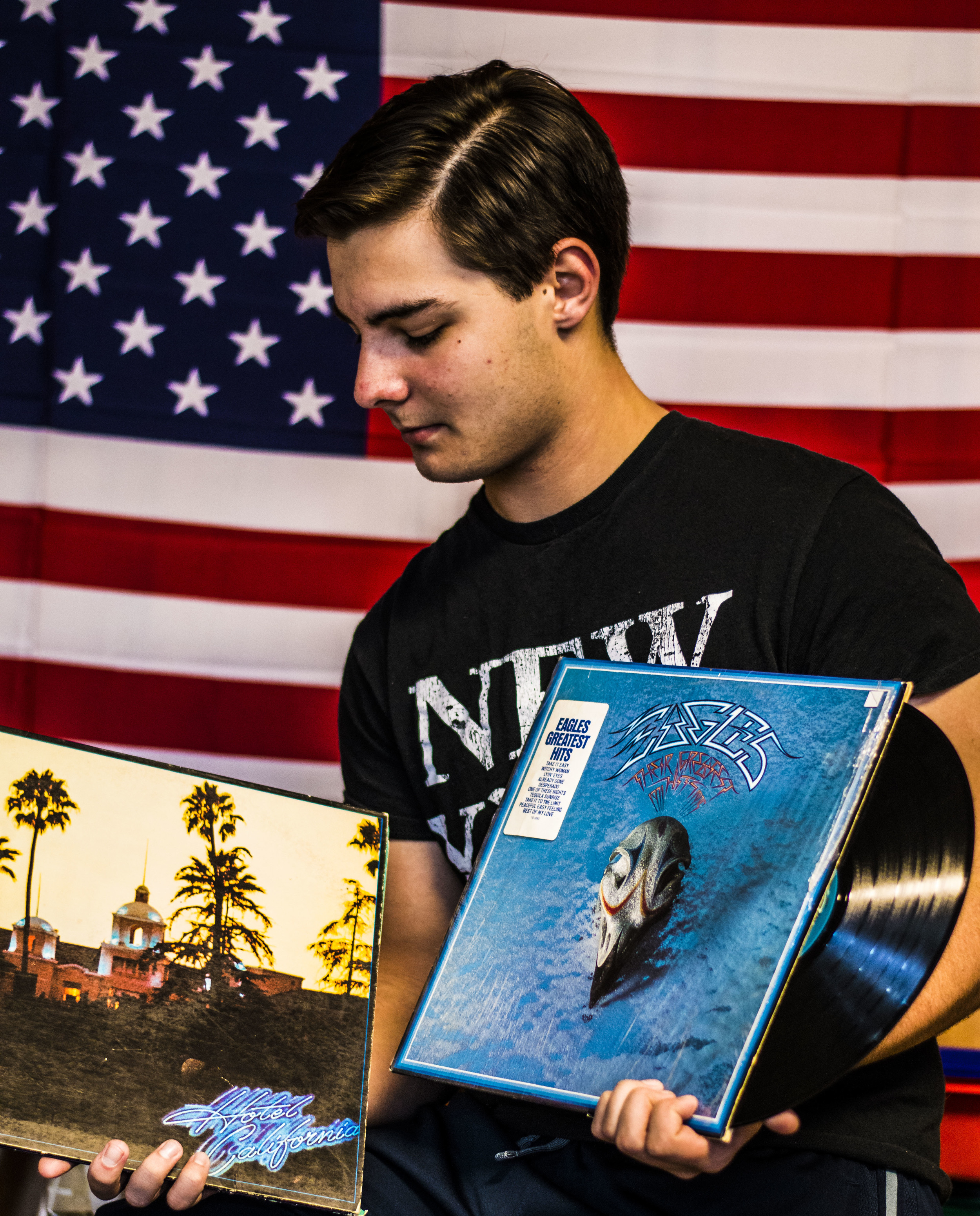 Taylor Welch holding two of his many Eagles records
