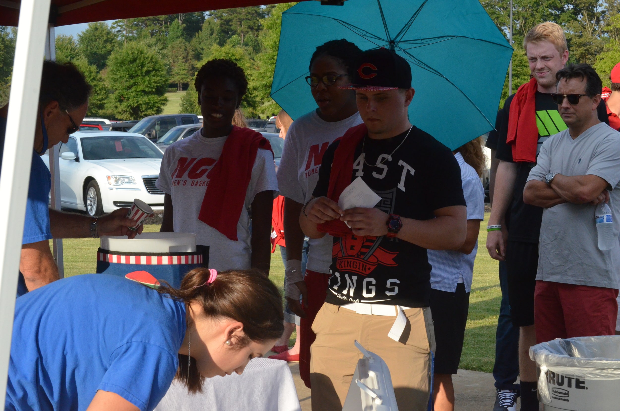  Students are in line to get free frozen treats from the local Italian Ice shop, RIta's. 