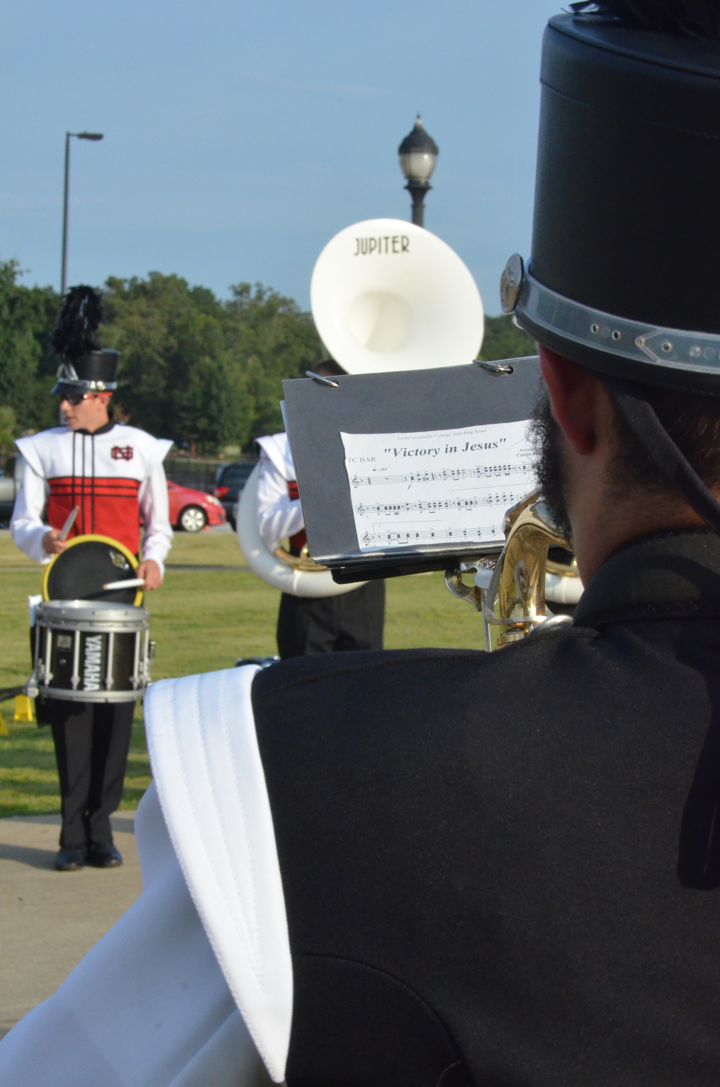  The band practices playing "Victory in Jesus" 