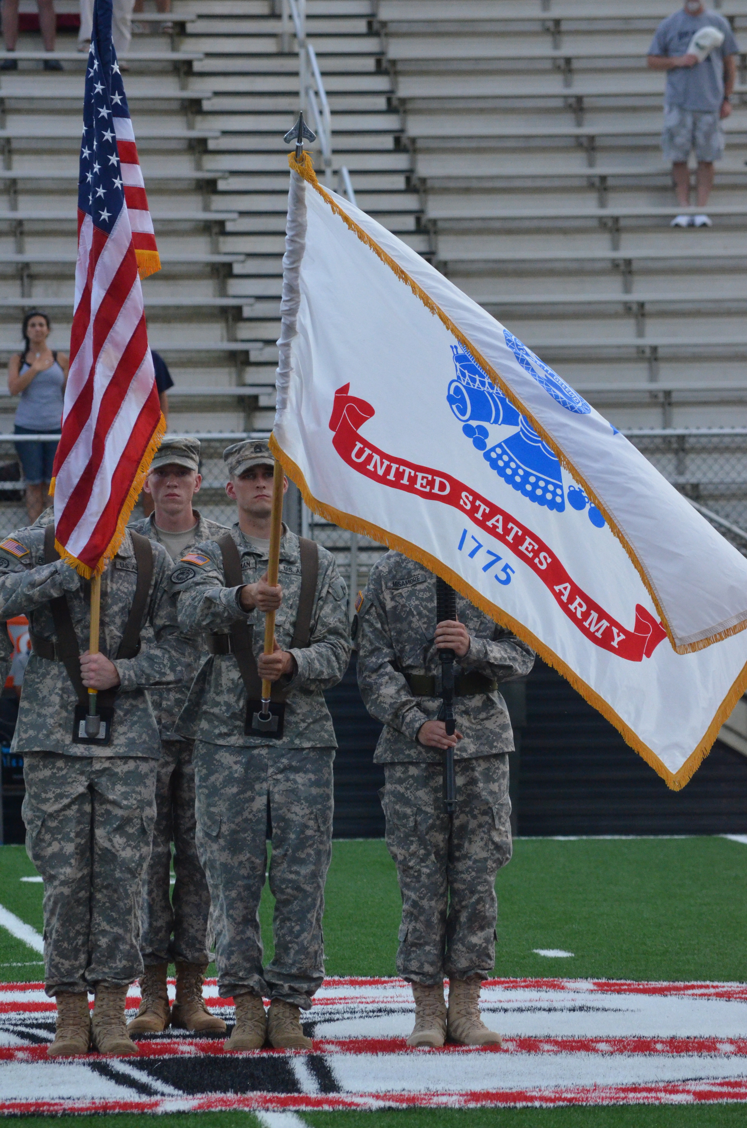  The Color Guard presents the American and US Army flags before the game starts. 
