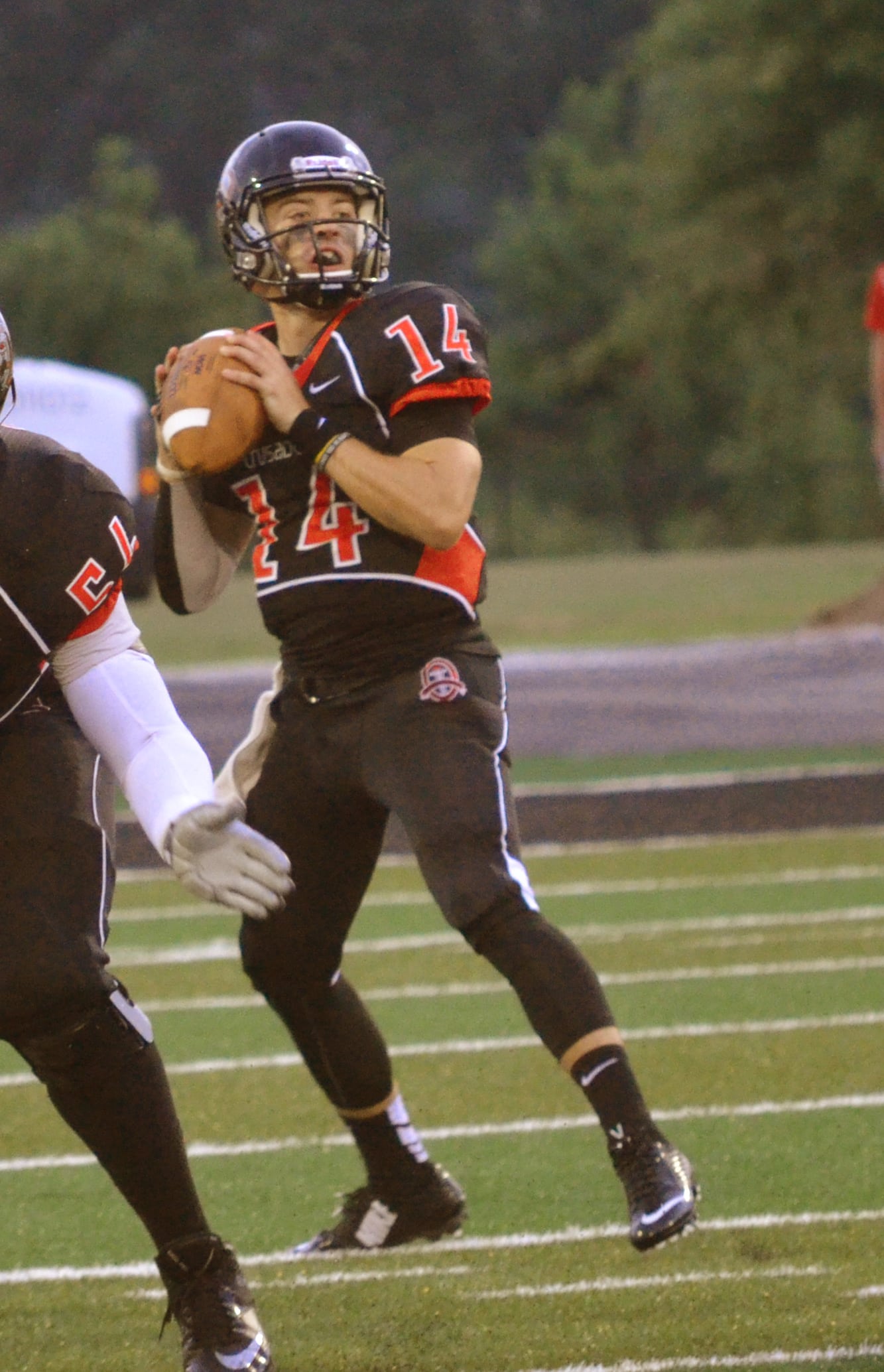  Quarter Back, Nelson Hughes, gets ready to throw the ball to the other side of the field 