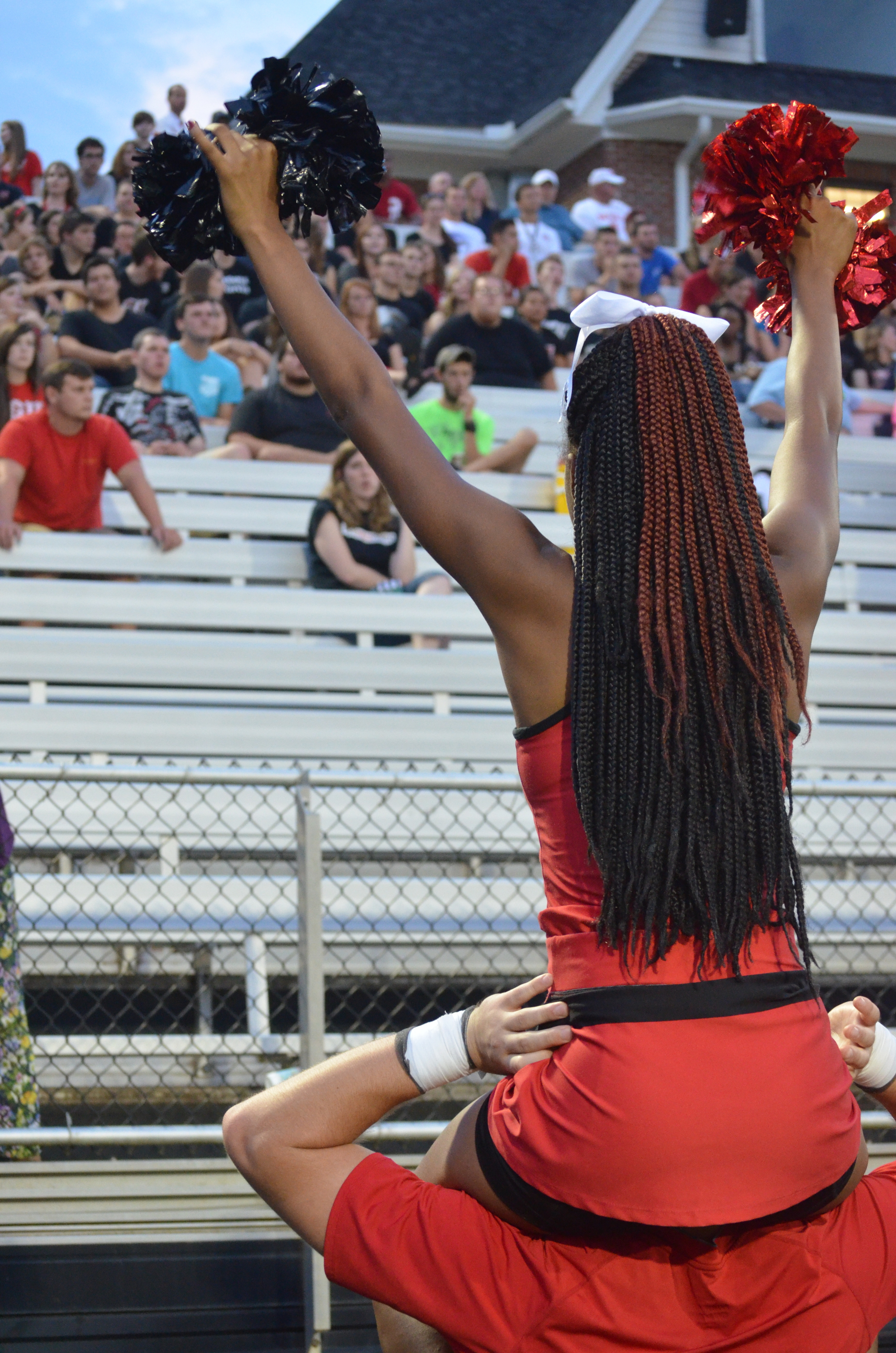  Cheerleader, Jay Whetstone, encourages the crowd to root for the Crusaders 