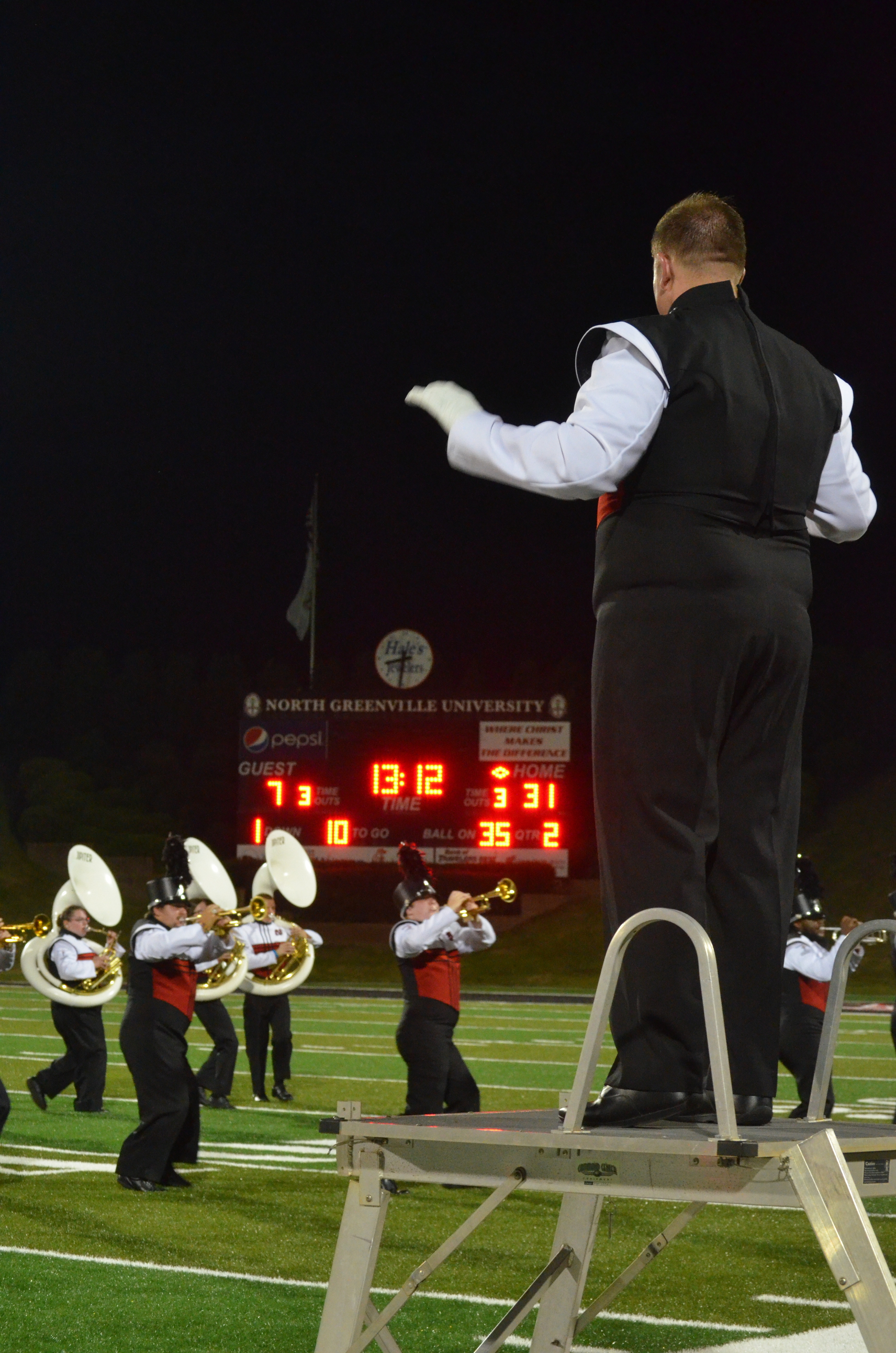  The Drum Major leads the band in playing 