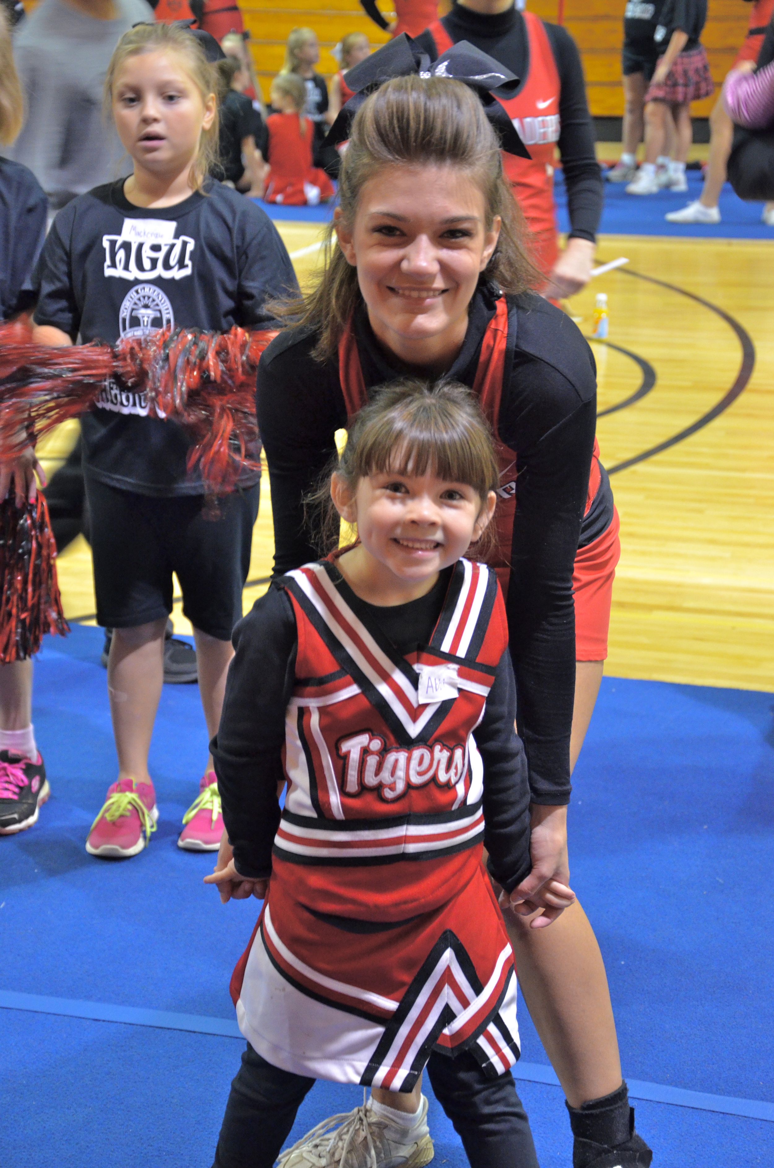  Cheerleading buddies pose for the camera before getting to work at the NGU cheer camp October 4. 