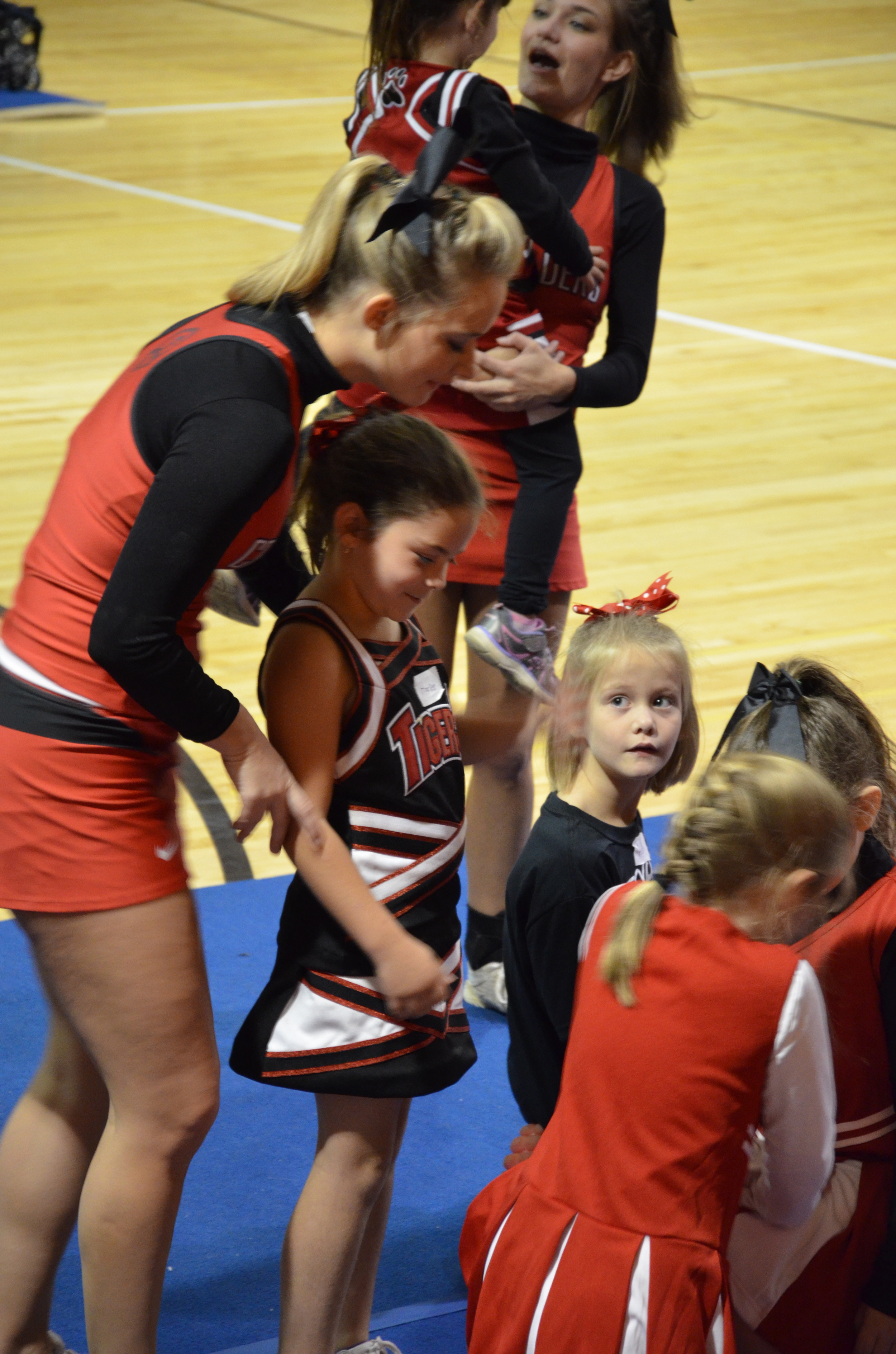  This little girl is ready to be lifted into the air by an NGU cheerleader. 