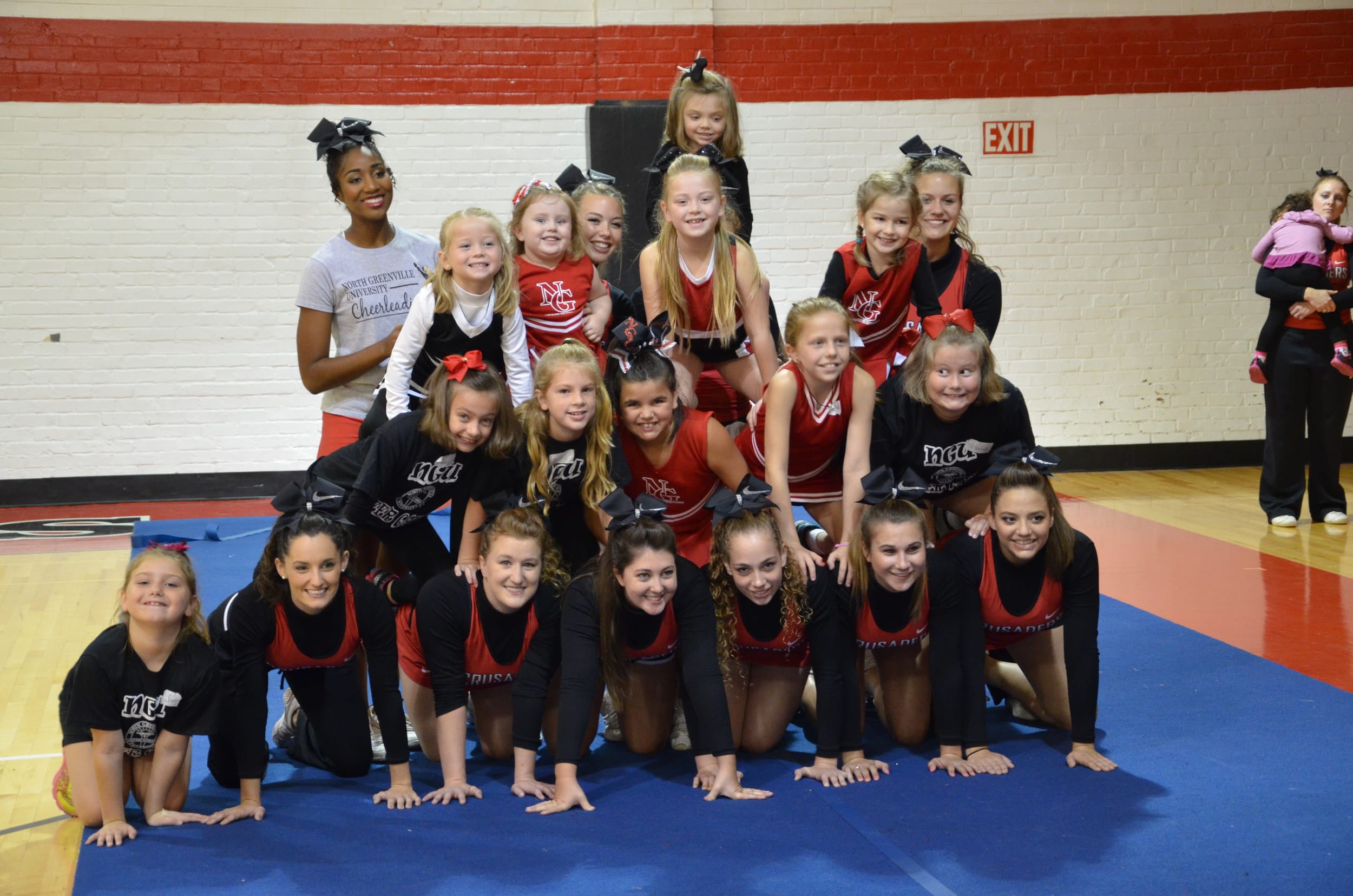  The final product consists of mini-Crusaders and NGU Cheerleaders at cheer camp last weekend. 