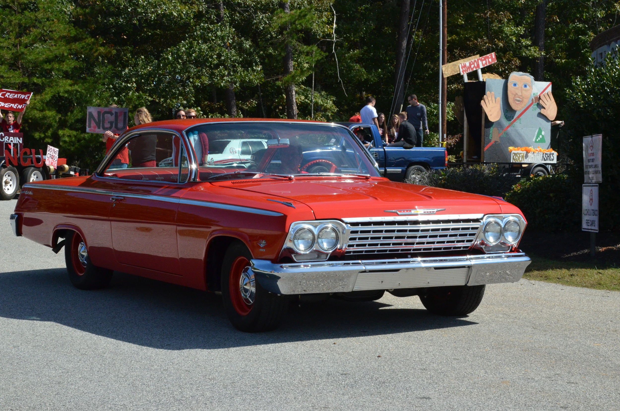  This car is definitely showing some style with that bright red. 