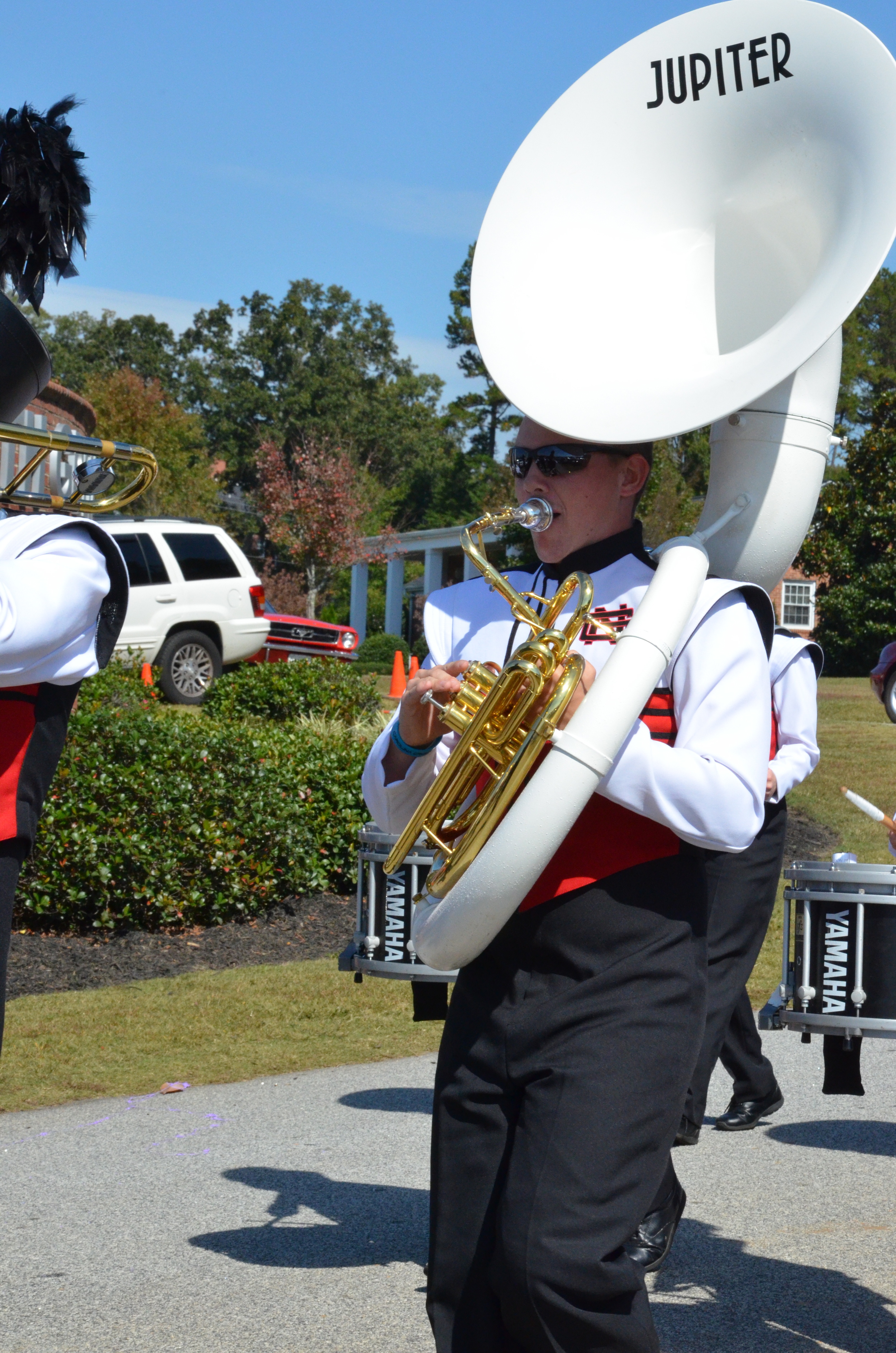  This tuba player is walking with pride, happy to represent NGU. 