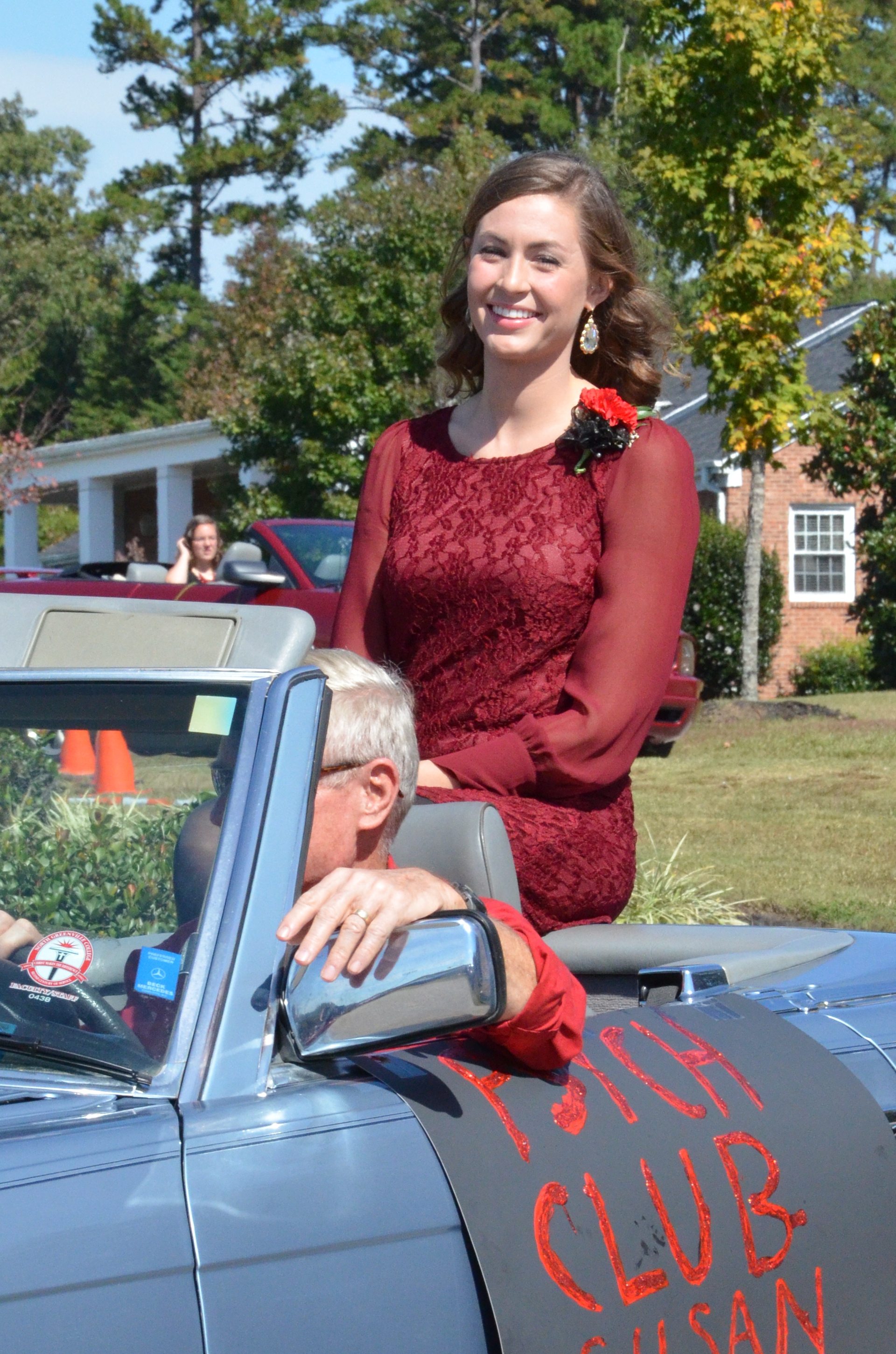  Susan Wood is happy to be representing the Psychology club as she rides through. 