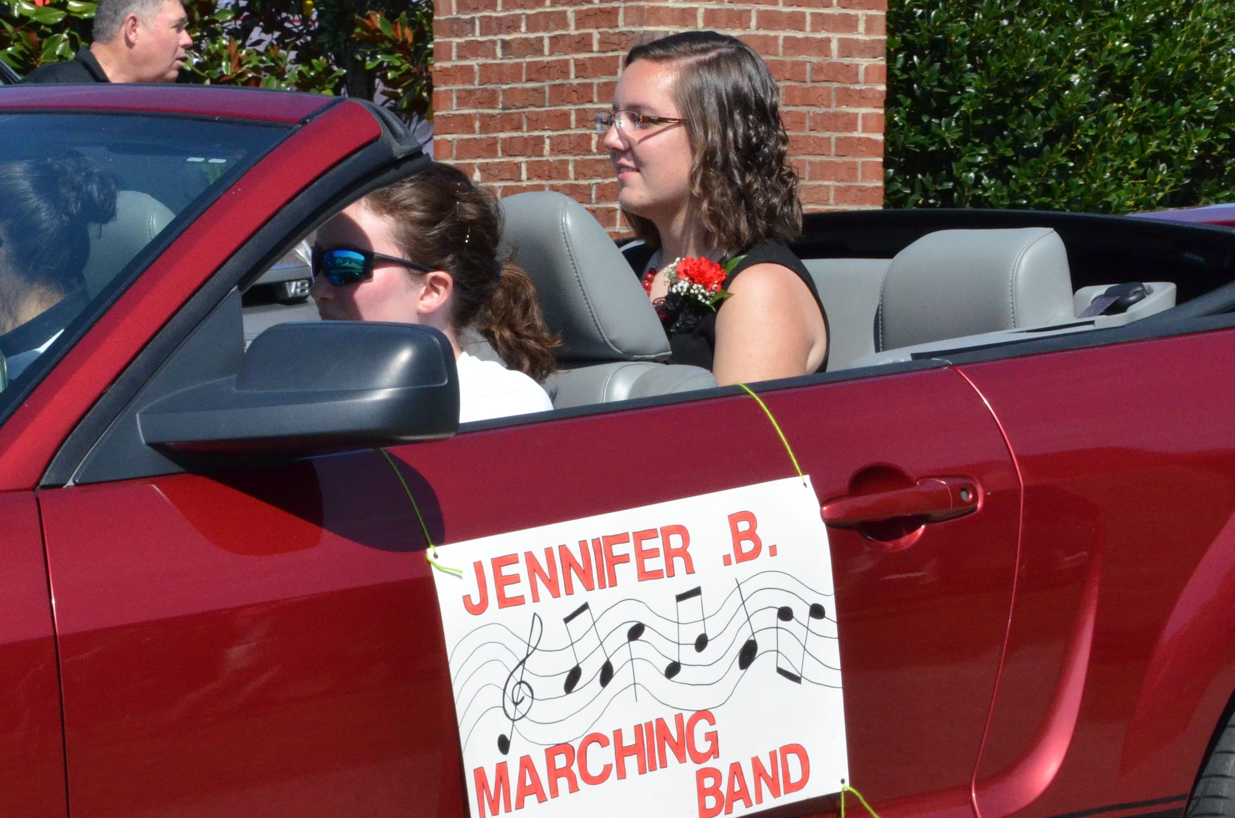  Jennifer Bramel sits happily in the Mustang as she represents the marching band. 