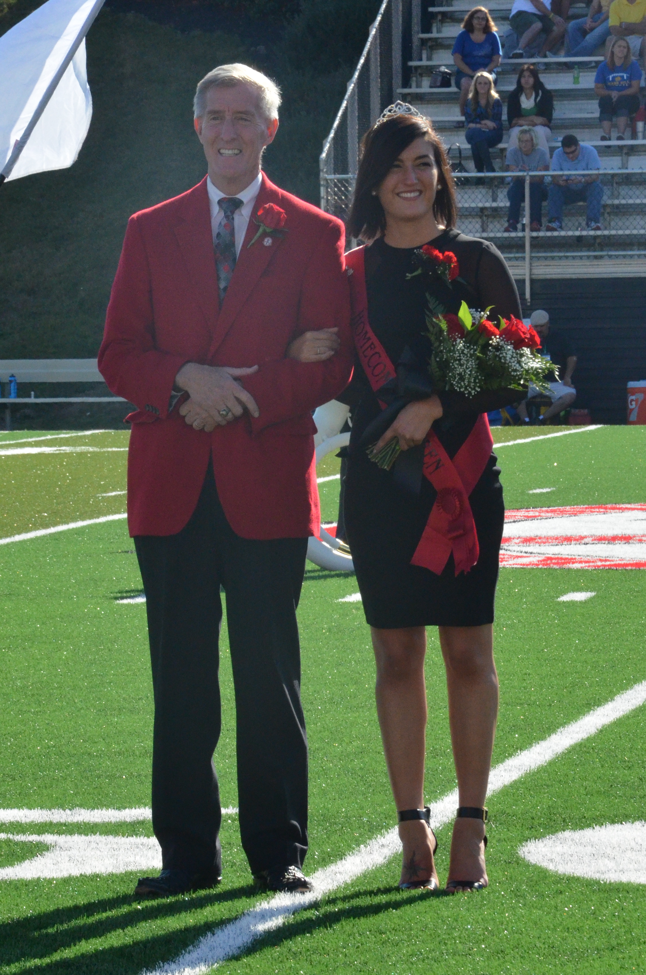  Dr. Epting and Sammi come on the field and are ready to pass the title on to this year's winner. 