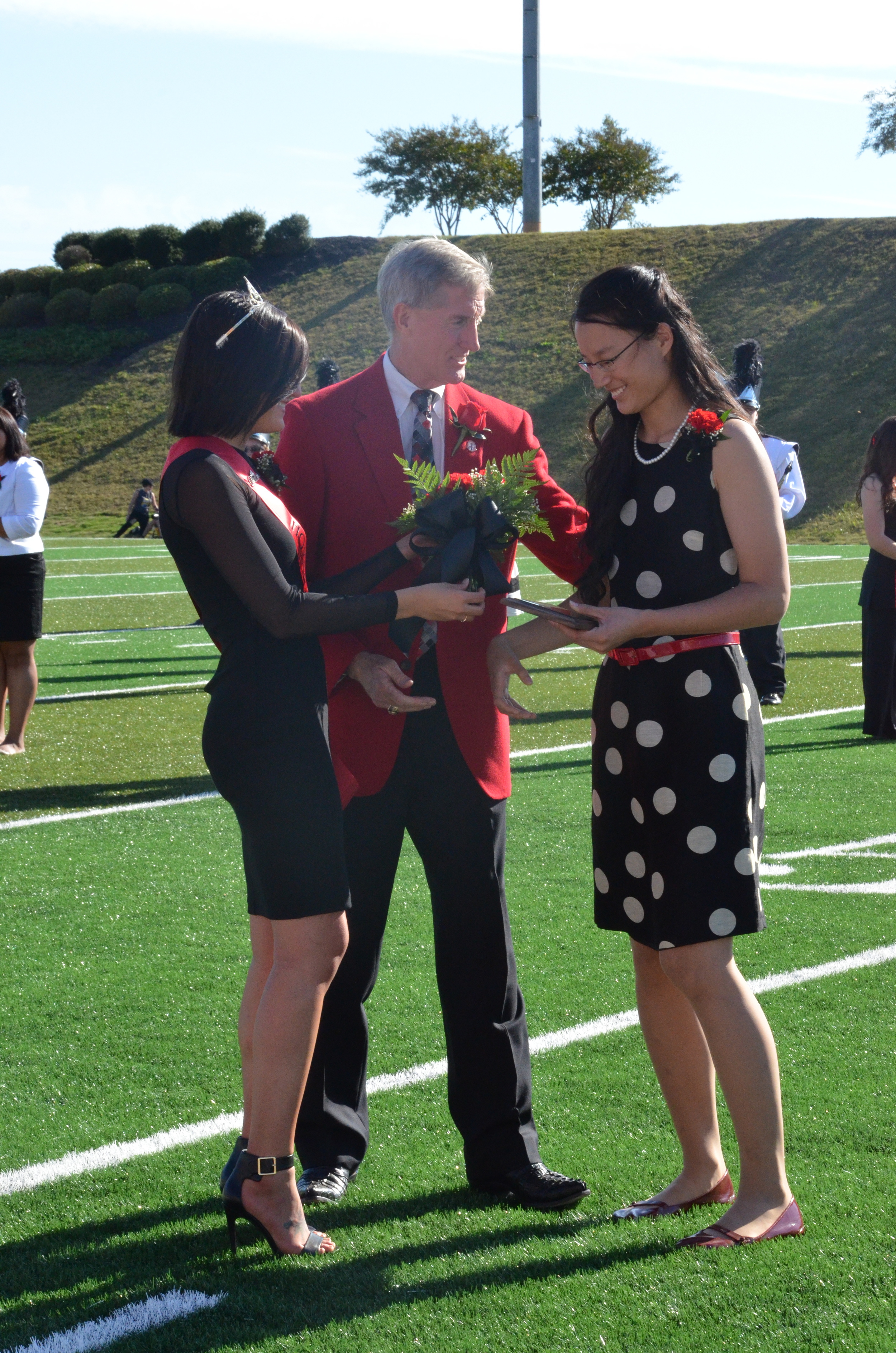  Sammi and Dr. Epting give Katy her award and flowers.    