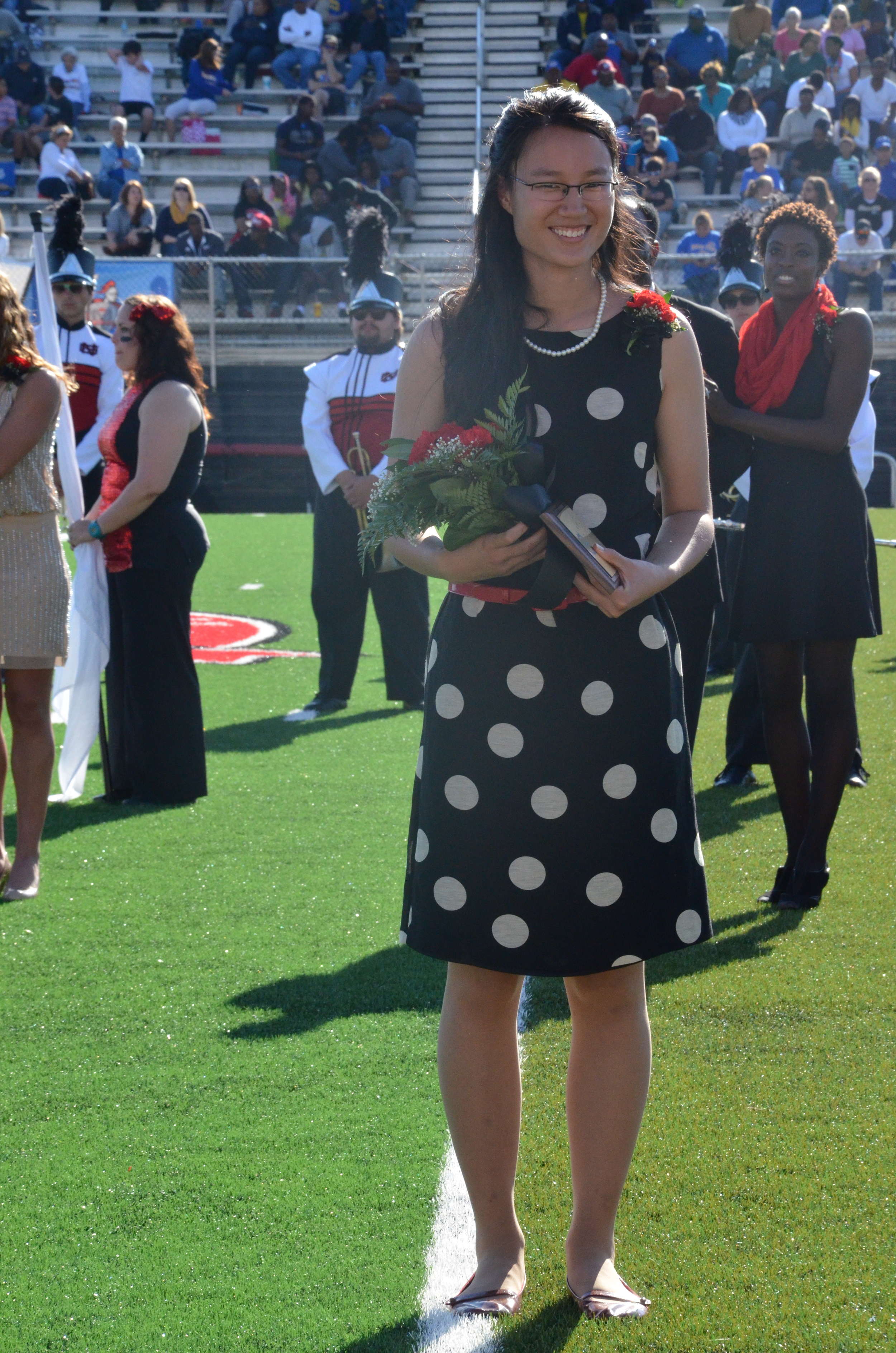  Katy stands proudly with her award and waits to hear the other winners.    