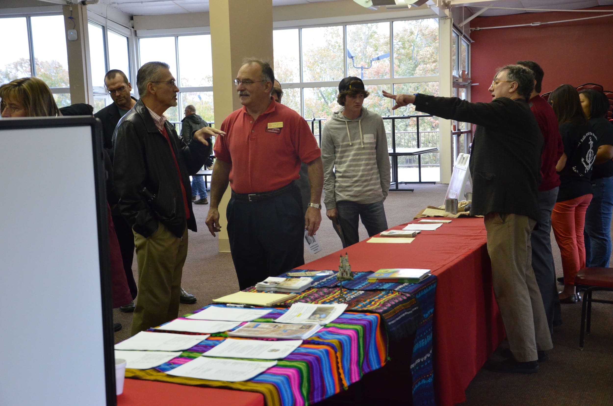  Some of the education teachers have conversations about the teaching programs. 