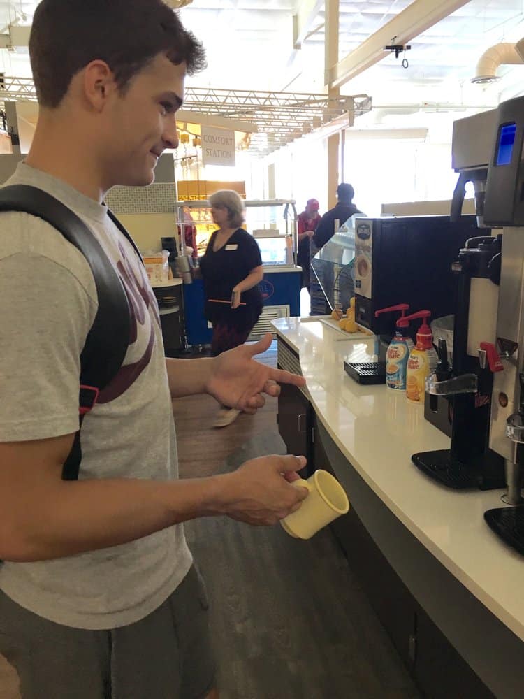 A student gets a beverage at the coffee station in the newly-renovated dining hall.