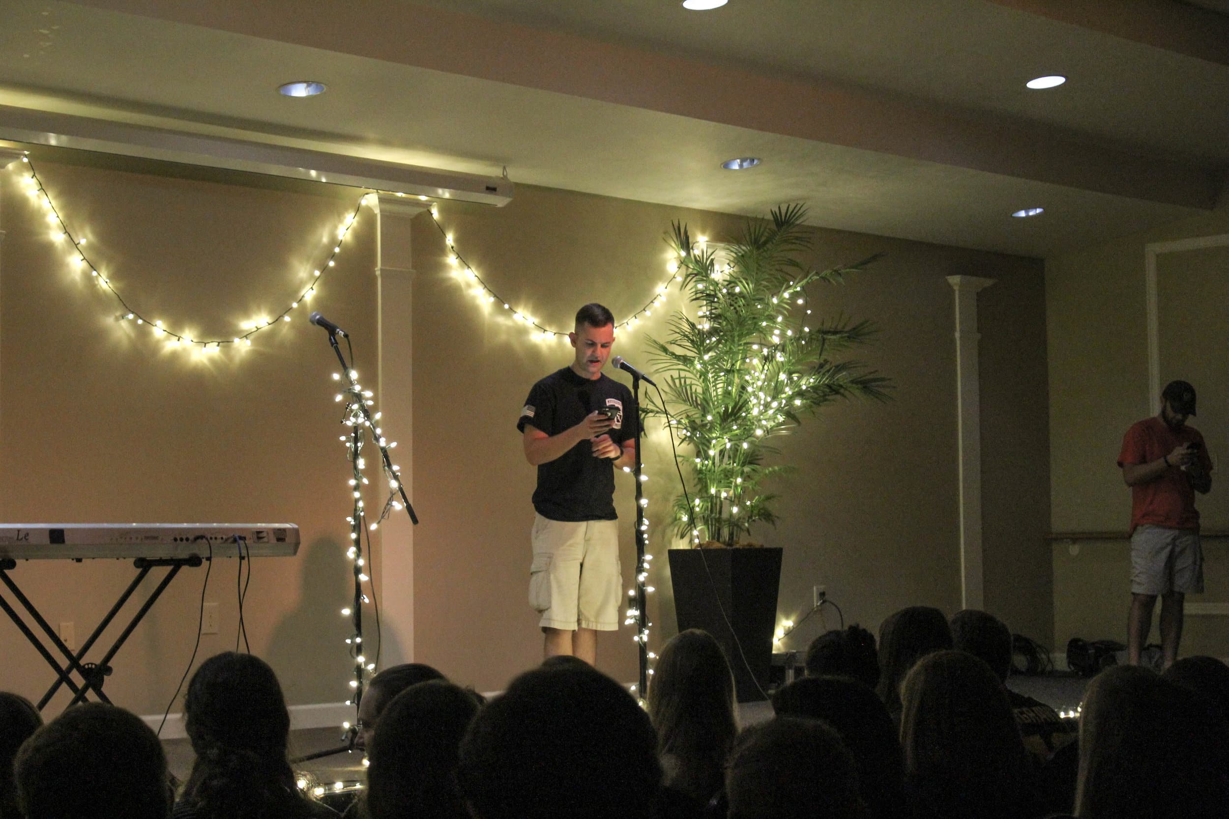 Senior, Nathan Burton, opened the coffeehouse up by reading an original poem on the crucifixion.