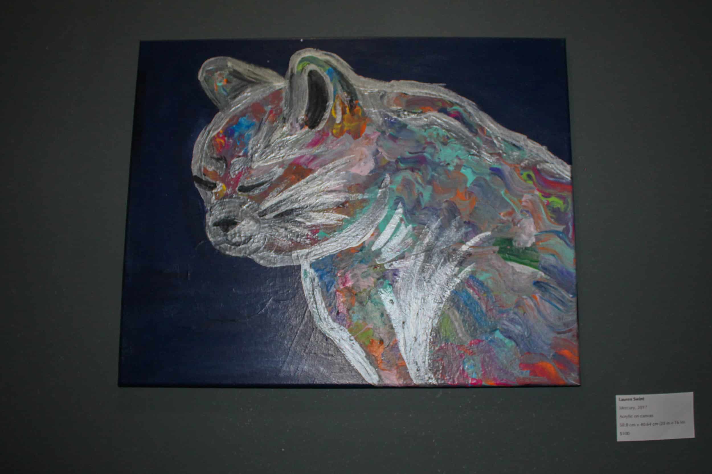 Featured throughout the cafe are portraits of cats made by local artists.