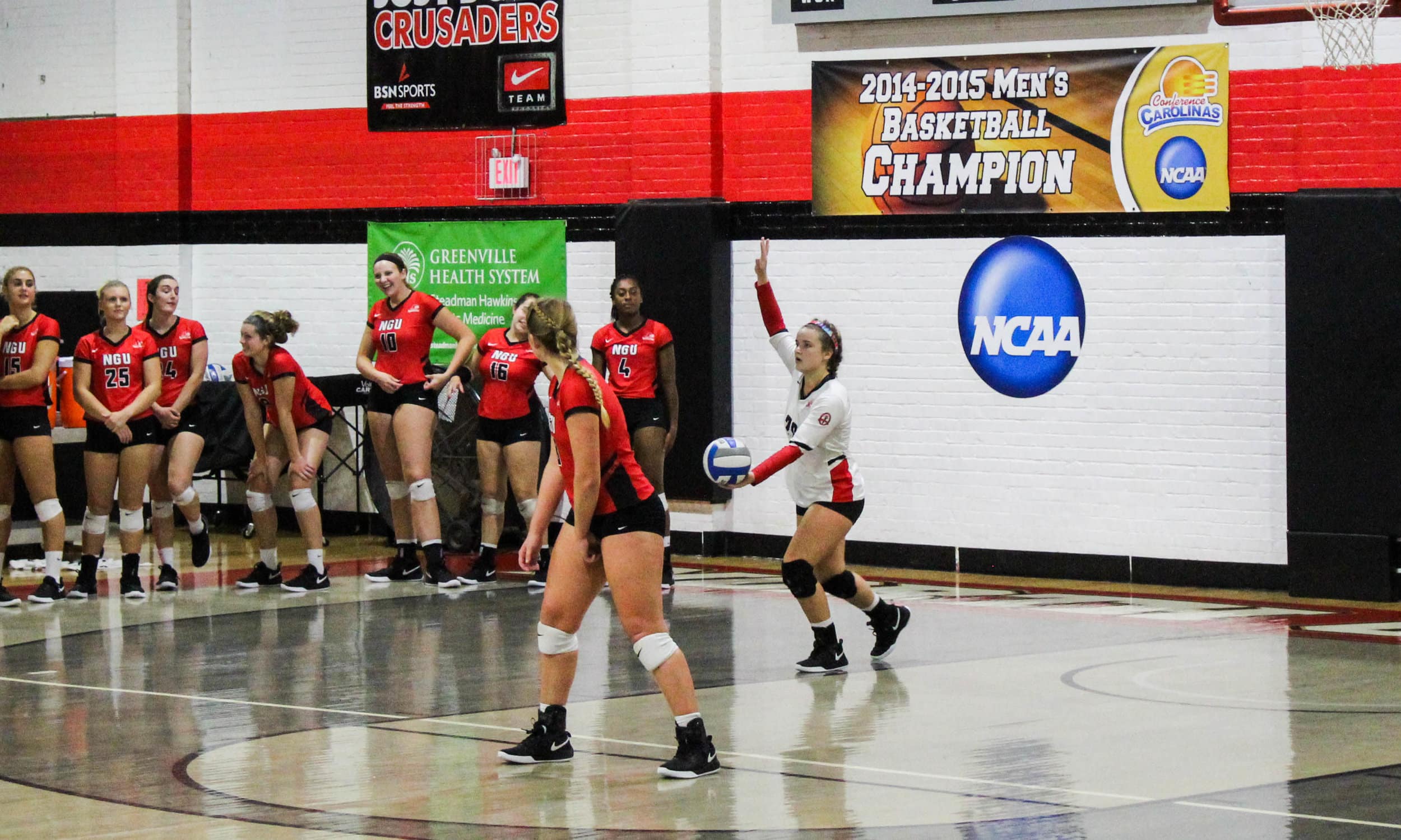 Freshman and Libero, Whitley Kahler (20), prepares to throw the ball up to serve it to the other side.