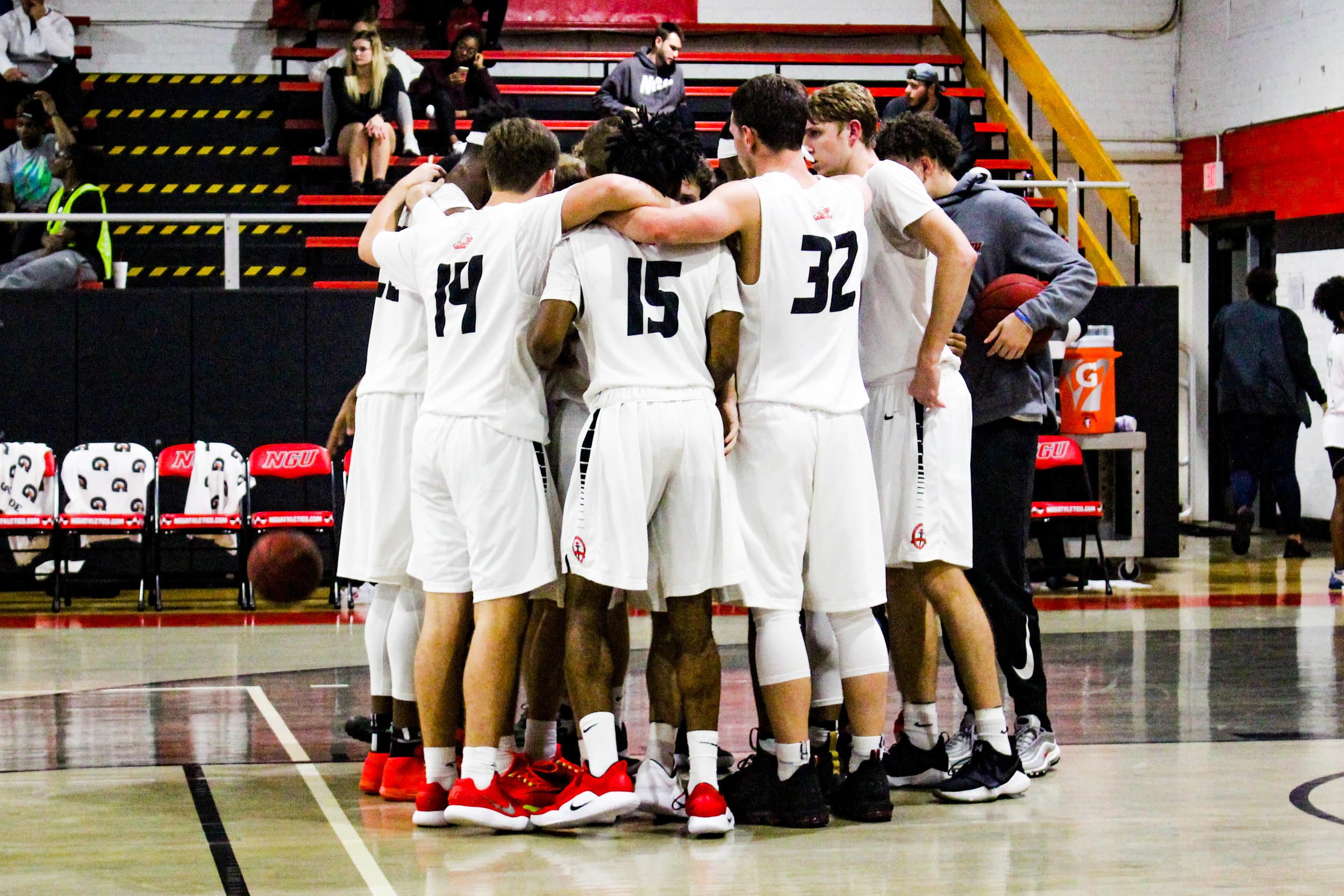 Returning from the locker room at halftime, NGU huddles together.