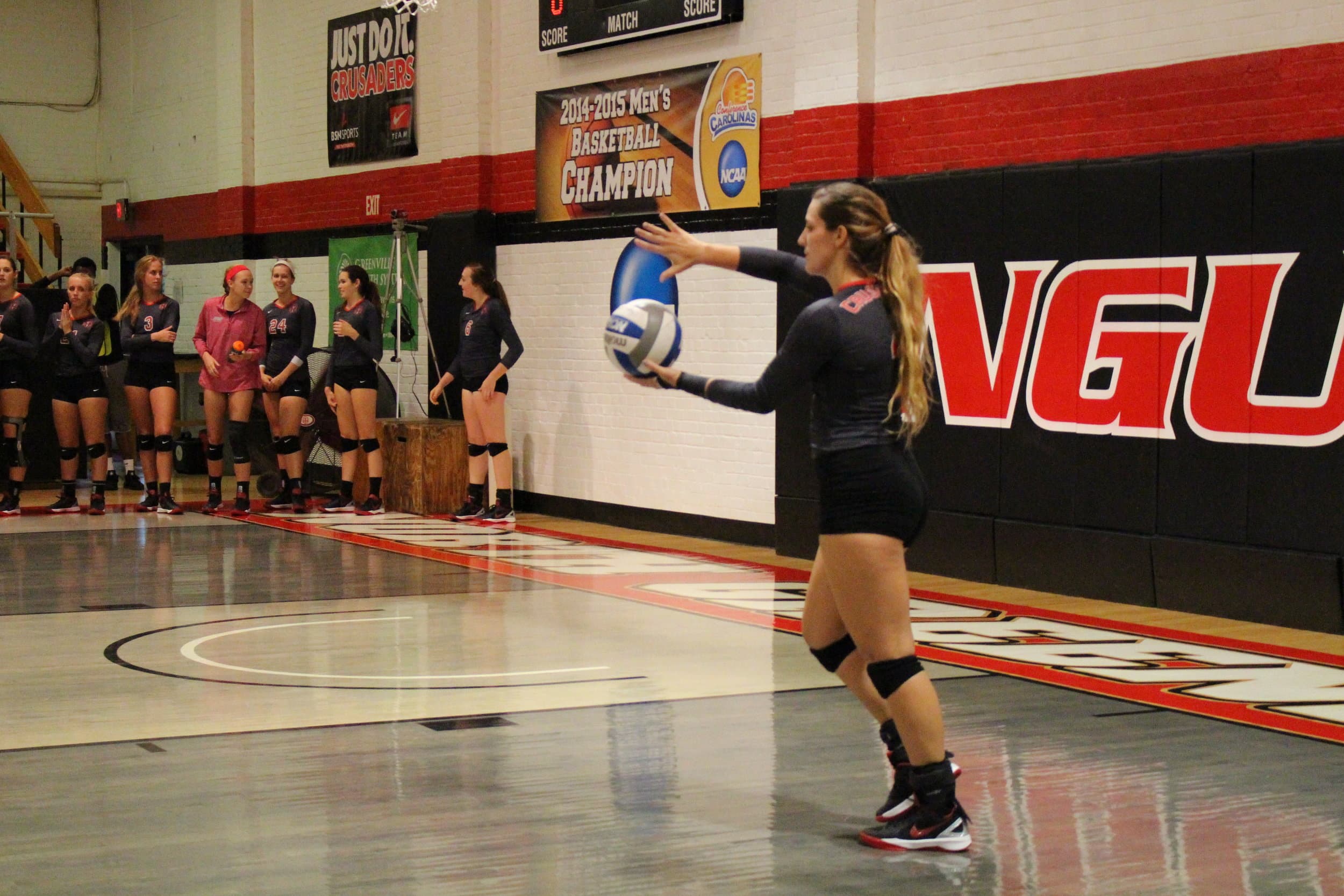  Ashlyn Wilkerson prepares to serve to maintain the lead.&nbsp; 