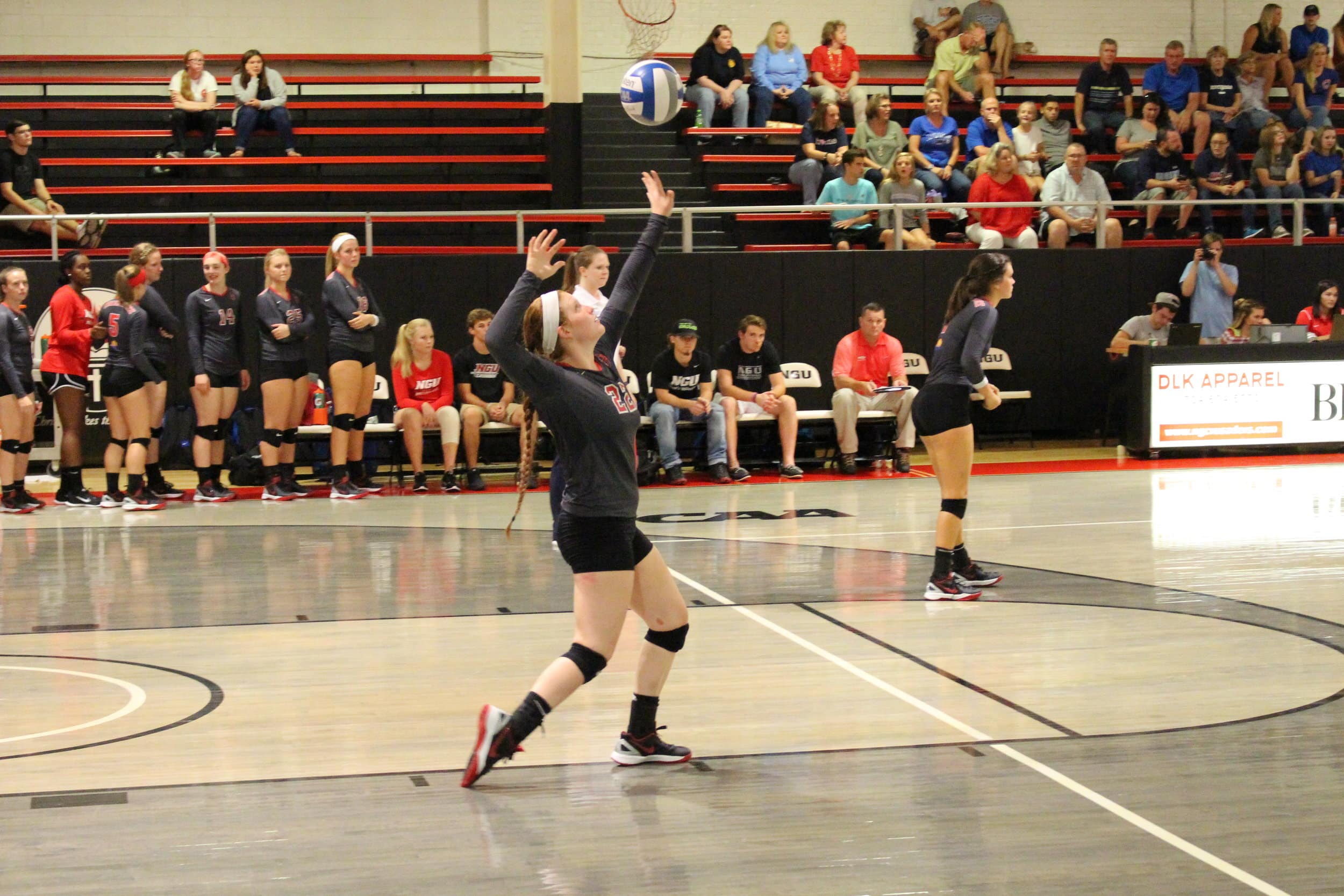  Madison Pogue serves the ball to gain the point.&nbsp; 