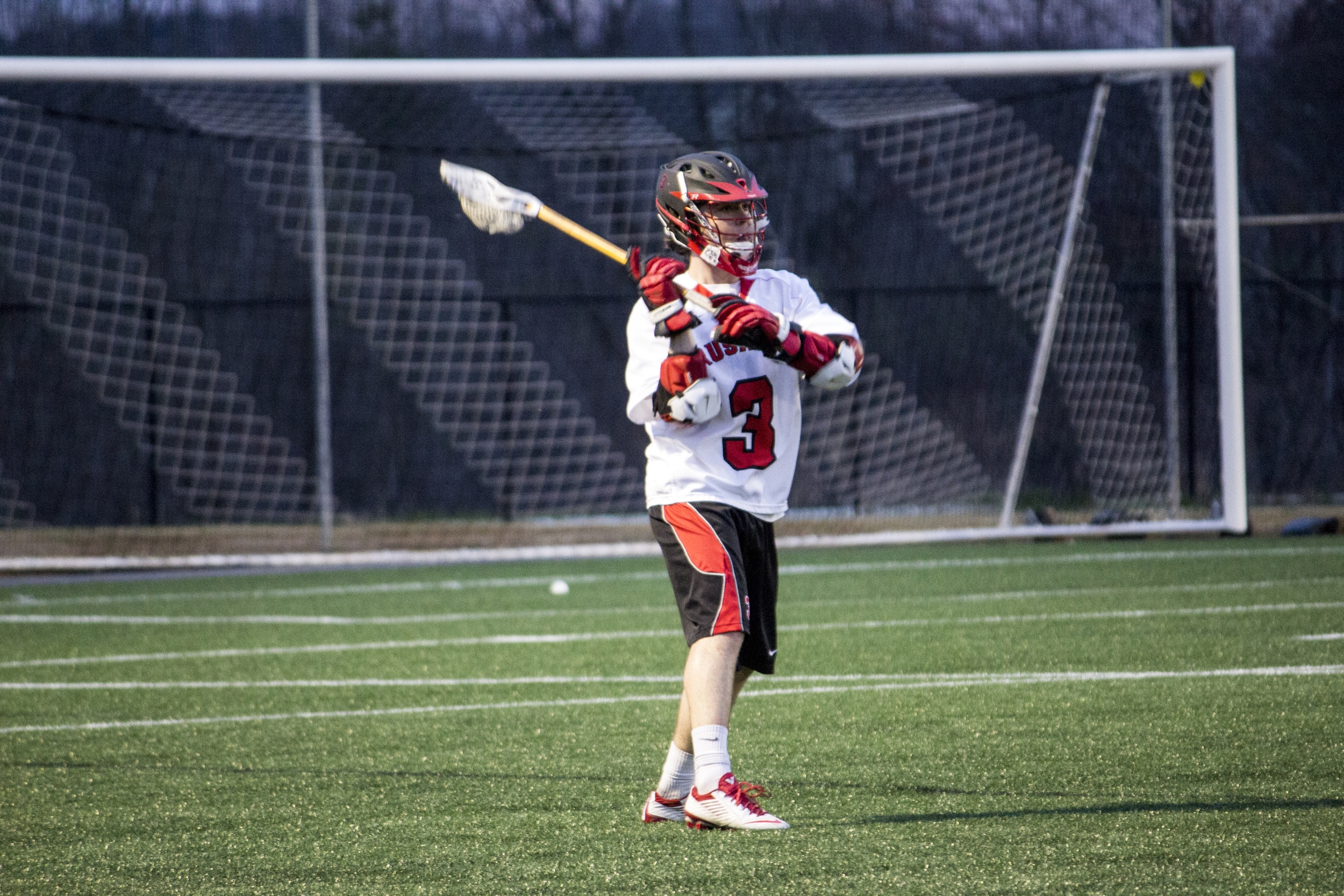  Freshman Ethan Gray surveys the field before launching the ball downfield.&nbsp; 