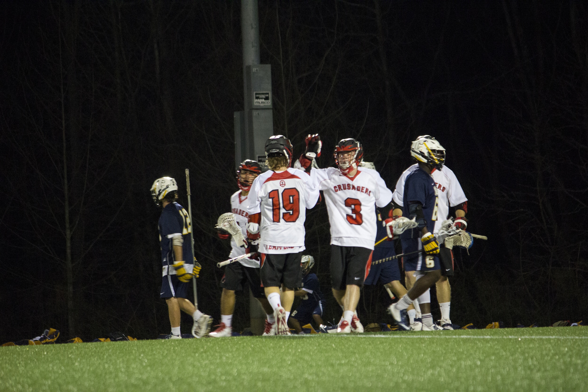  Sophomore Brandon Petter congratulates Ethan Gray on his goal.&nbsp; 