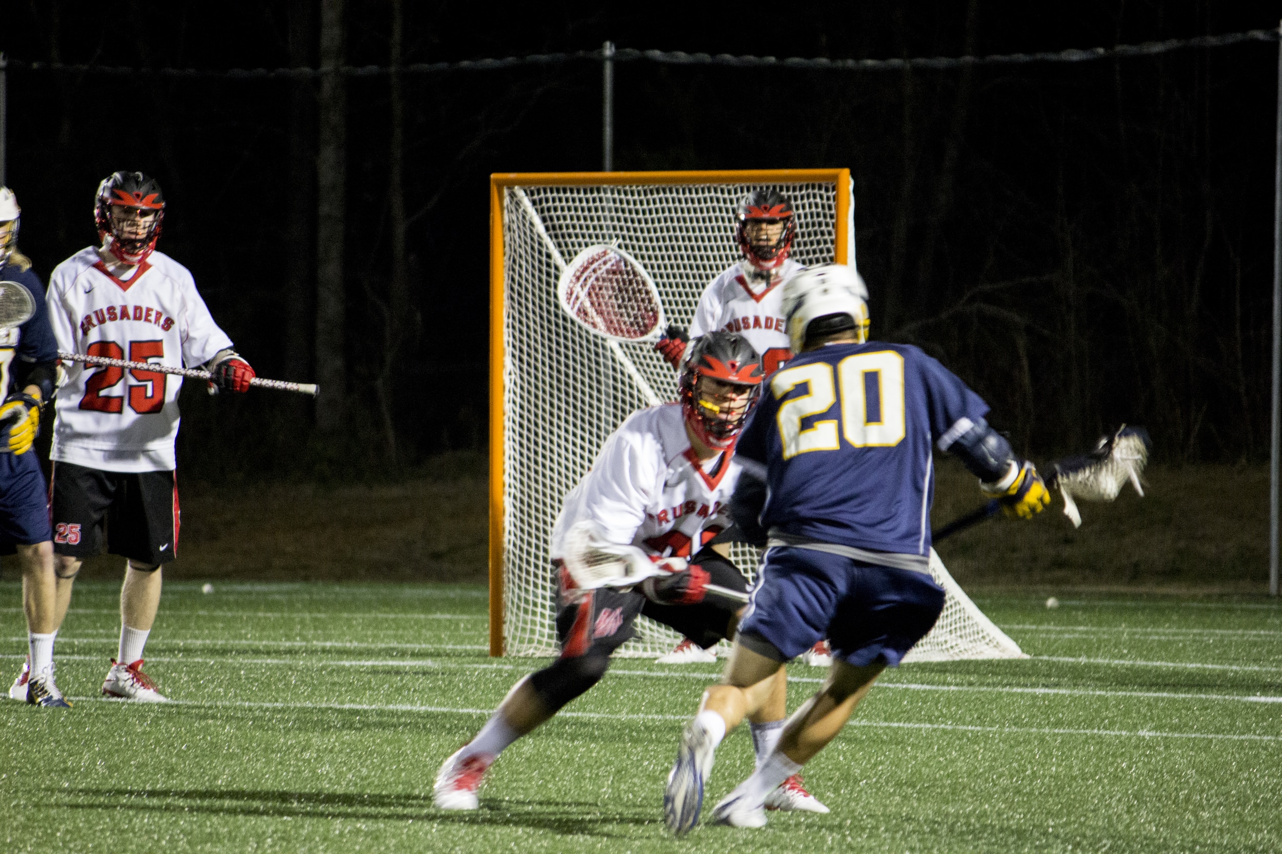  Freshman Allen McBride keeps himself between the goalie and #20 to prevent the shot from being taken.&nbsp; 