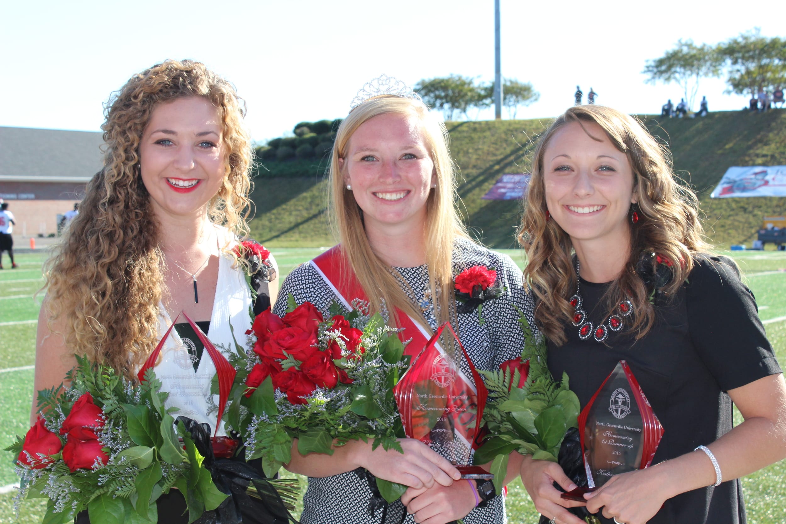  The homecoming queen and runner-ups posed for a photo after the event. The photo features Anna Shoop, Christie Reilly and Kathryn Allen. 