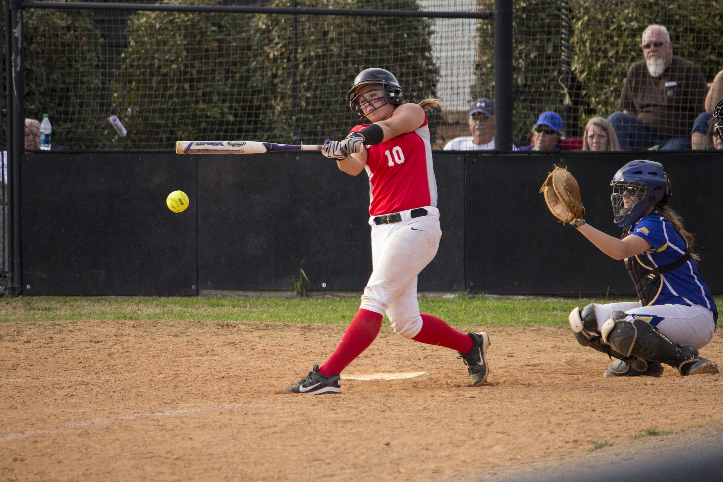  Freshman Taylor Wilson connects with the ball and sends it flying down the third base line.&nbsp; 