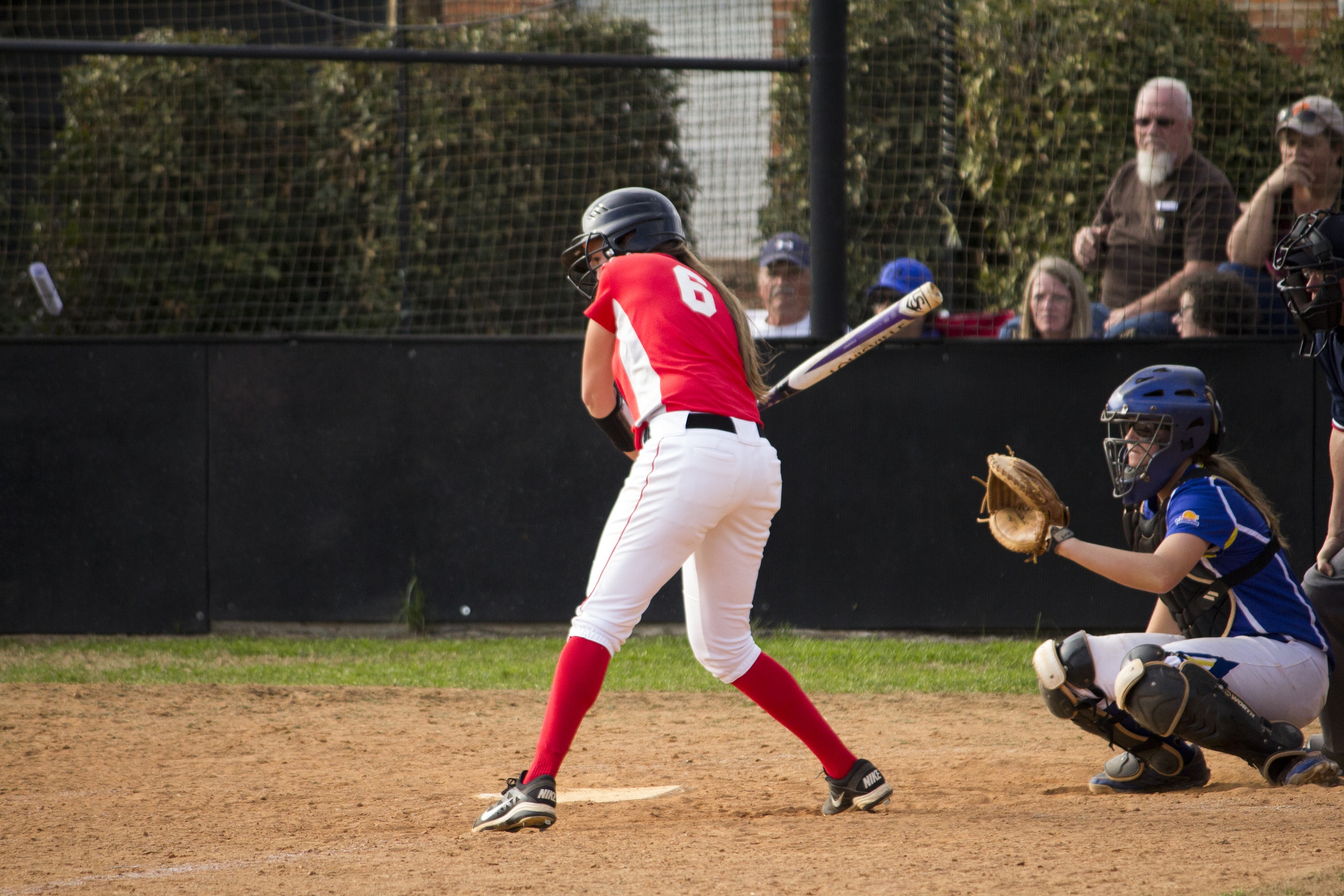  Freshman Celsea Rivers anticipates the pitch in hopes to connect with the ball.&nbsp; 