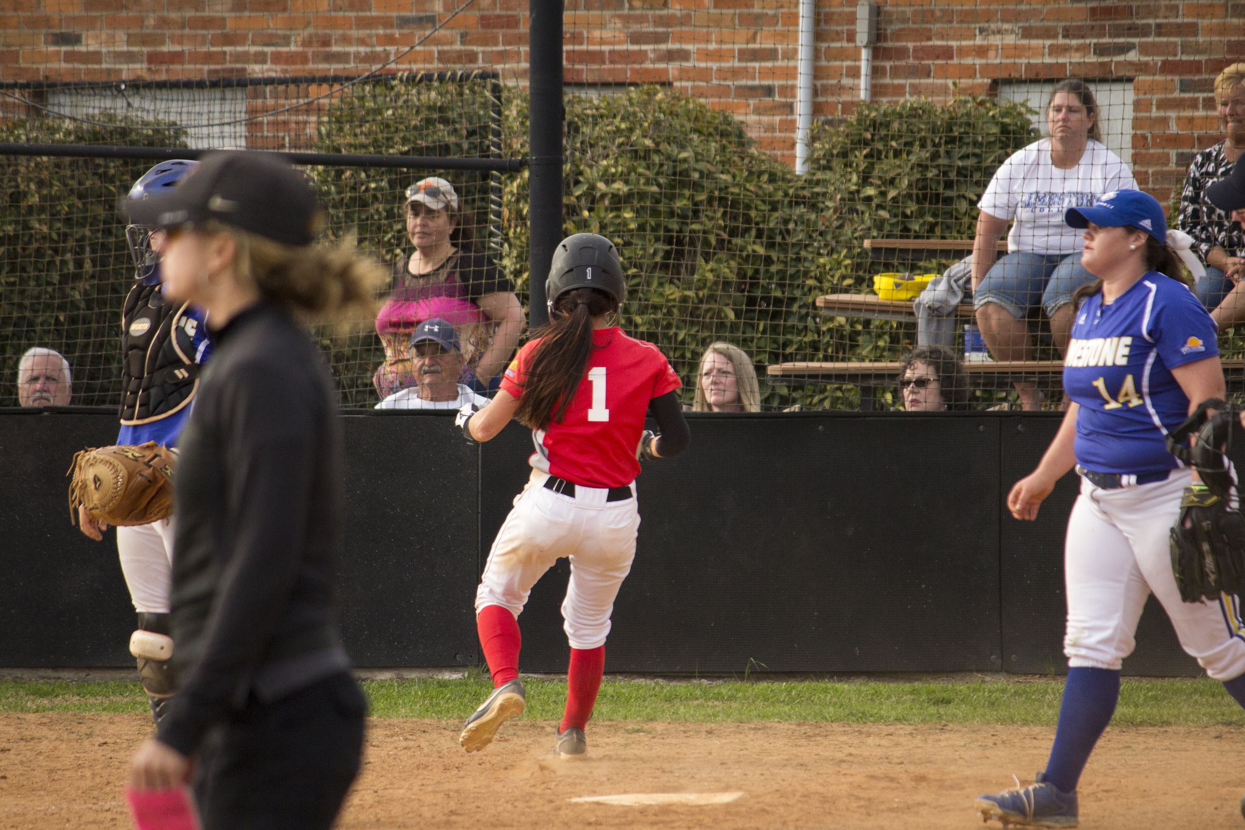  Sophomore Shayna Finley rounds off her run to home plate scoring another run for her team.&nbsp; 