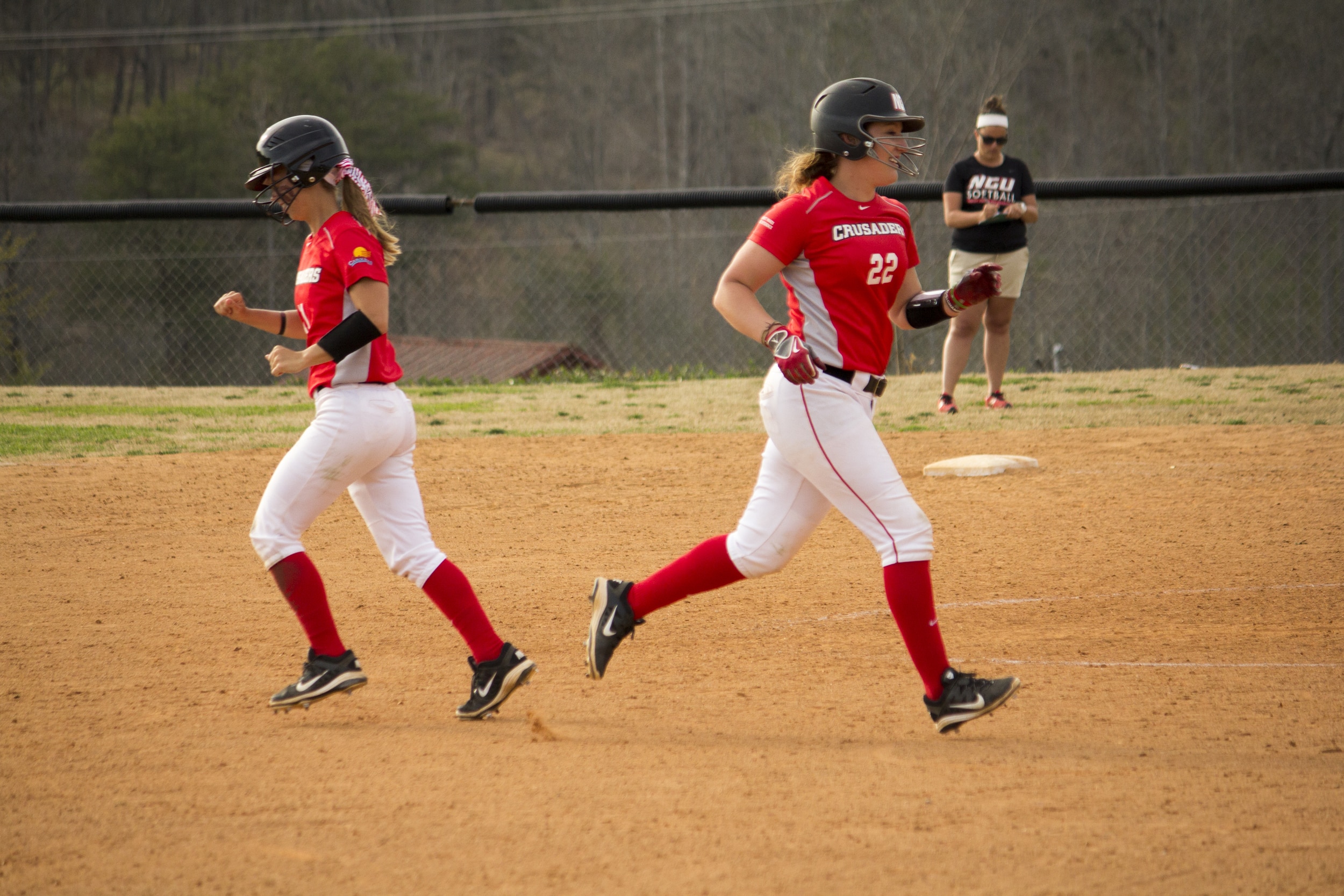  Senior Tori Freedman high fives her teammate as she runs off the field to switch out.&nbsp; 