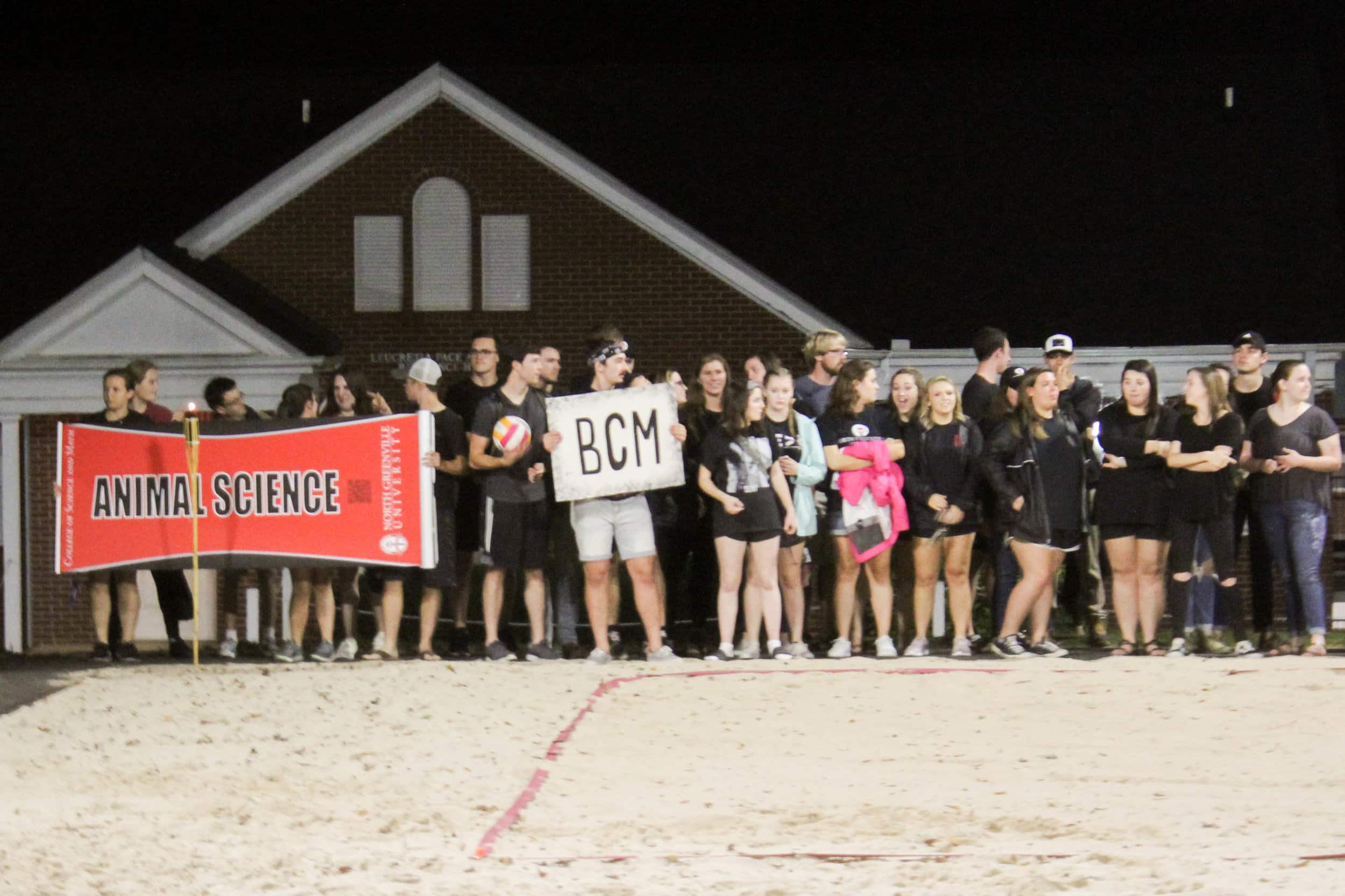 The animal science club and BCM line up and wait for the other clubs to line up.