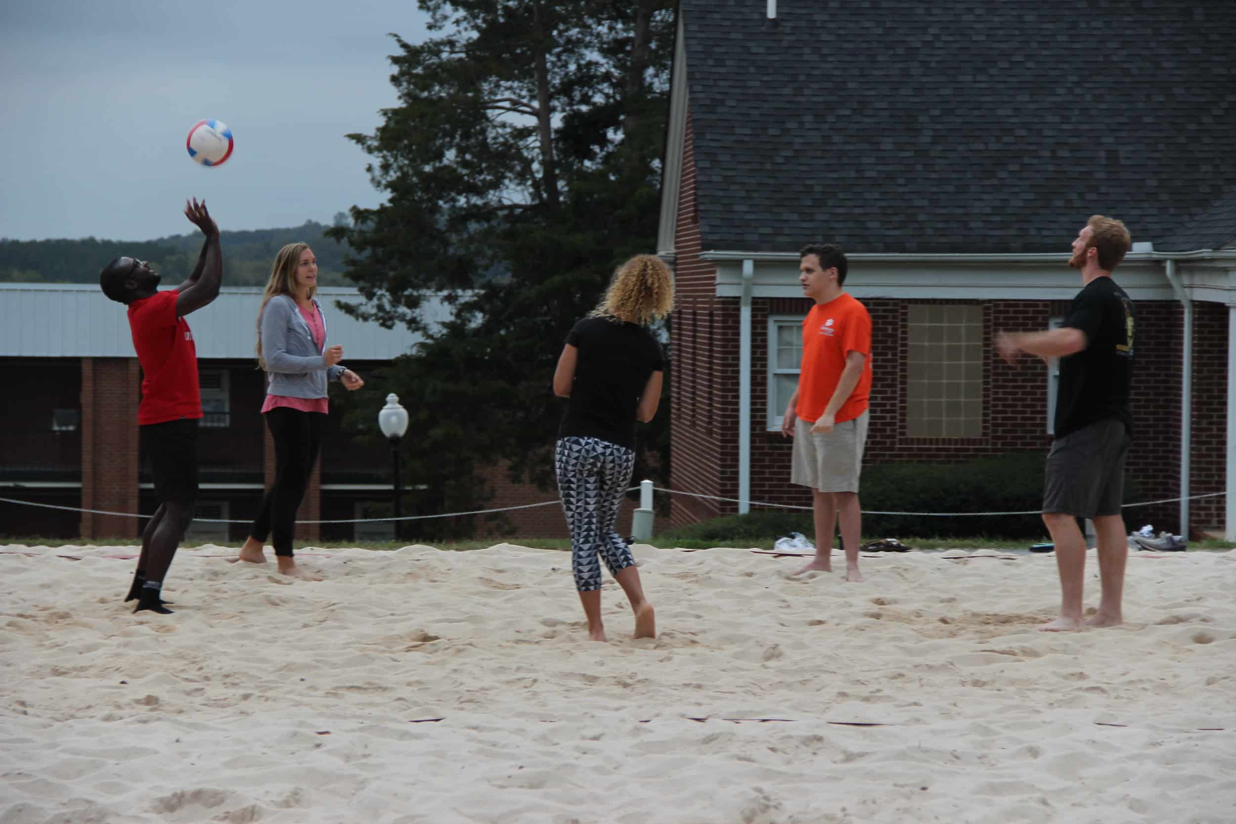 Students playing volleyball.