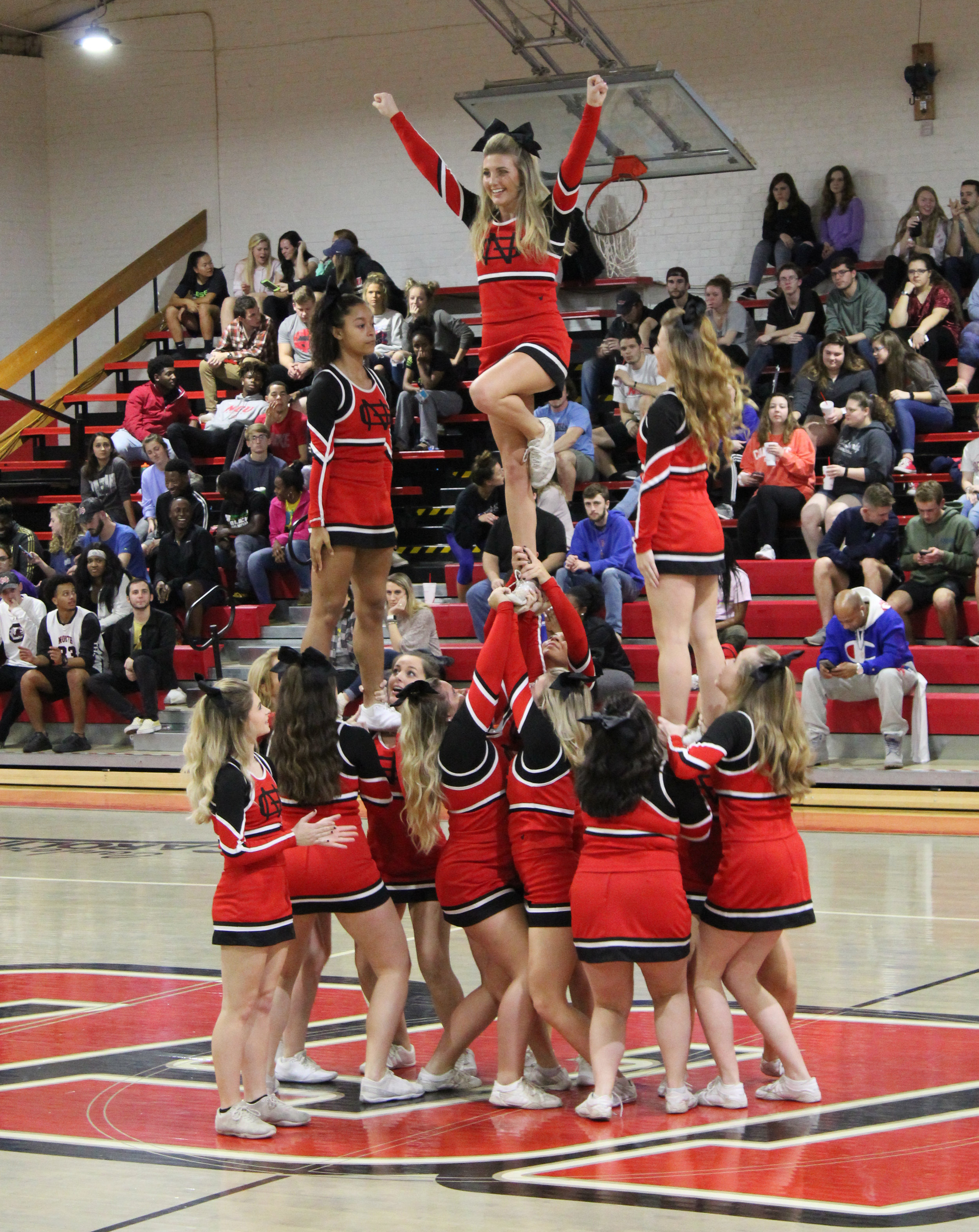 The North Greenville cheerleaders accomplish a stunt during one of the timeouts.