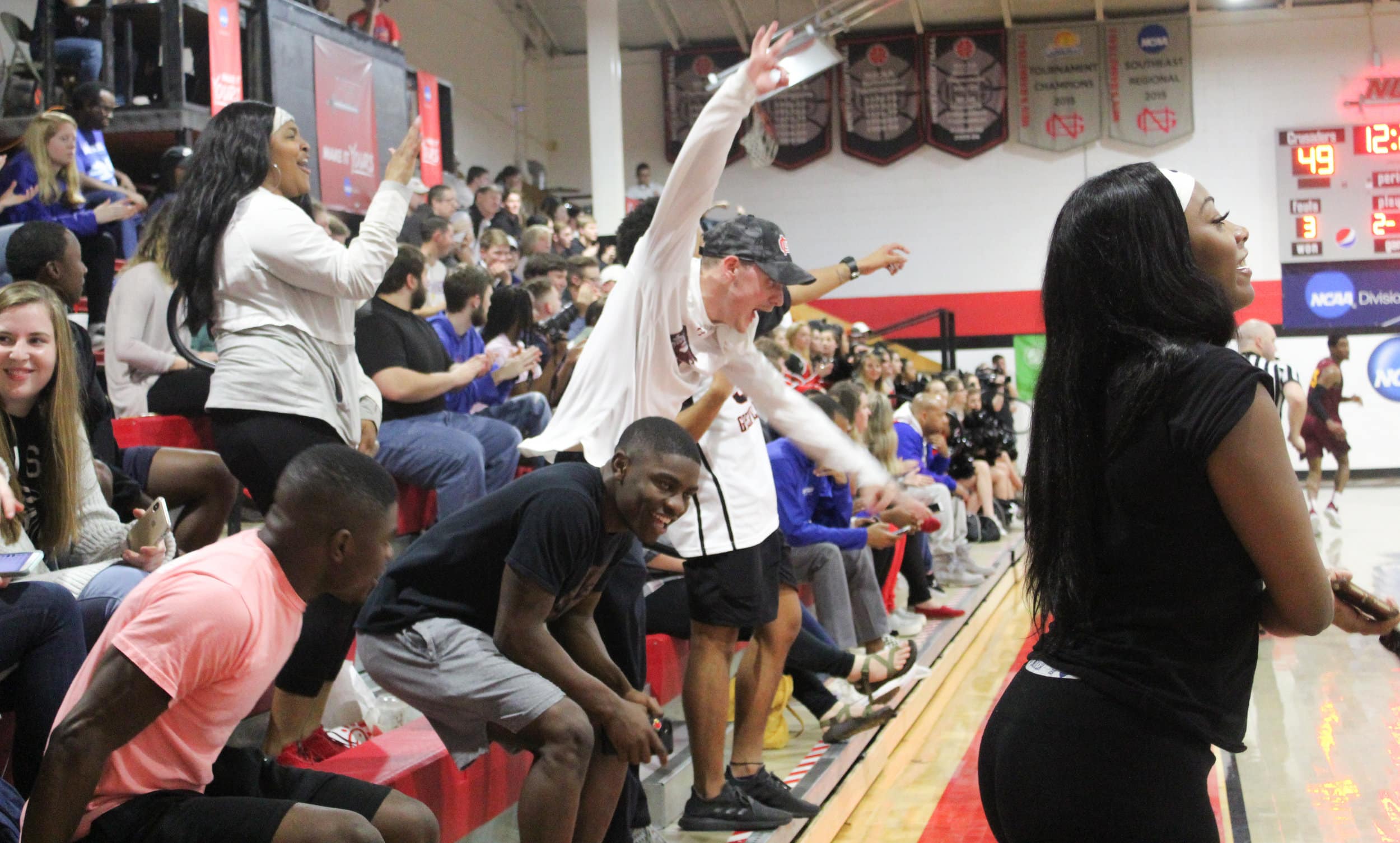 The North Greenville student section goes wild during the nail-biting game.