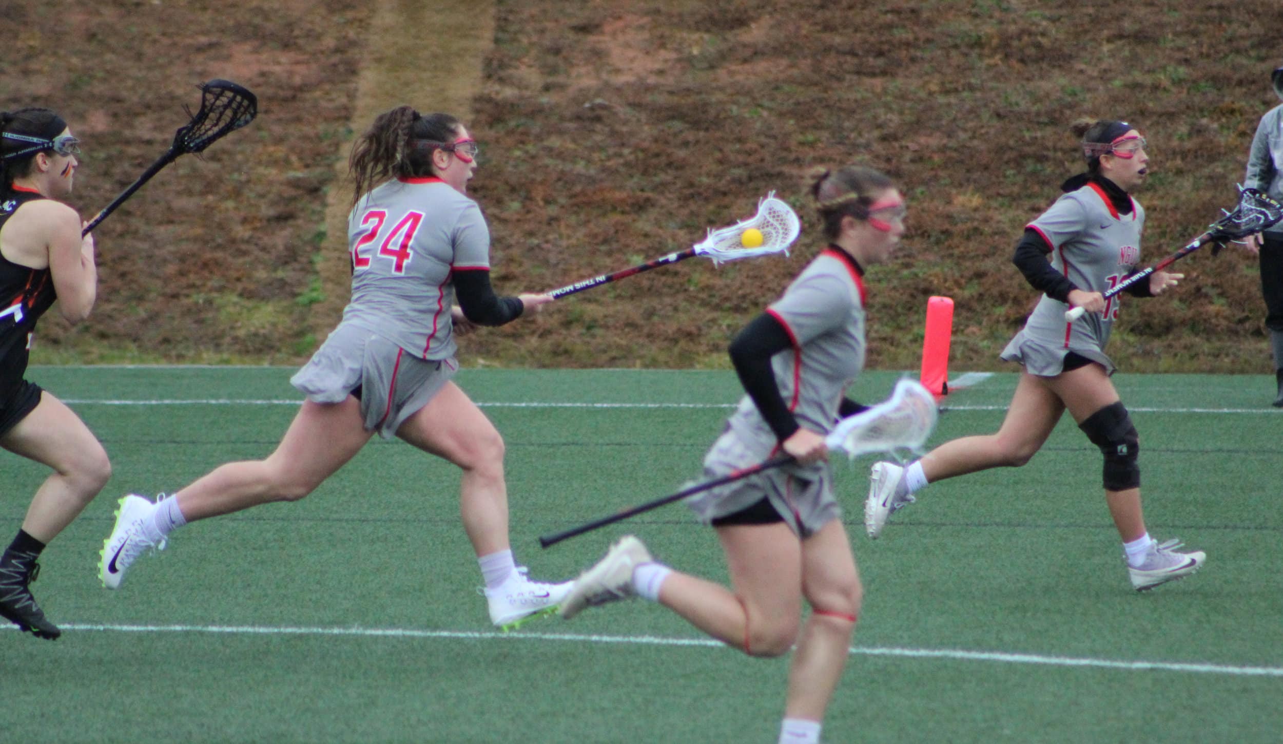 Junior, Brenis Napoli, 24, runs along with her teammates towards the goal.