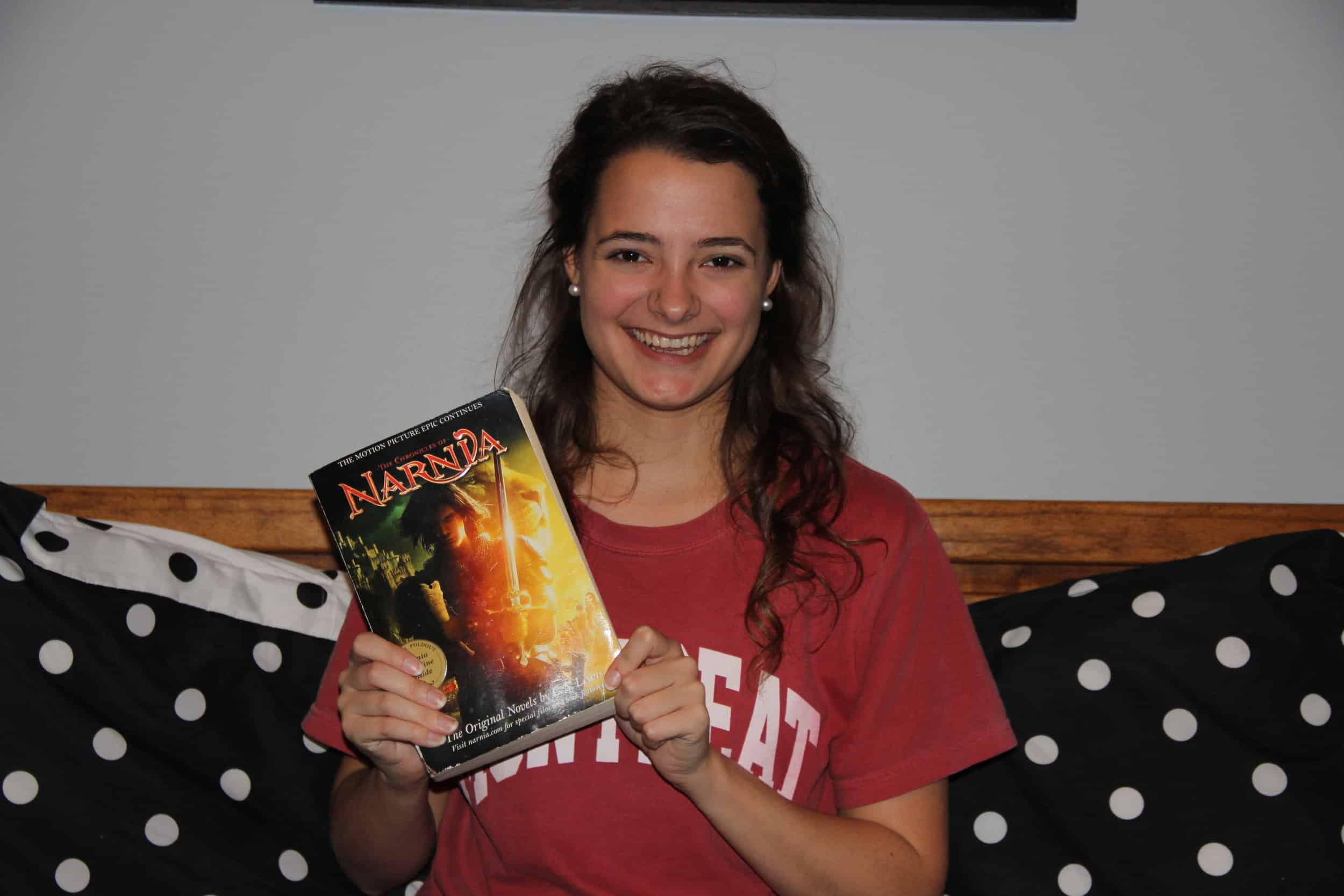 Nicole Daniel (Freshman - Digital Media)&nbsp;smiling with her favorite gift. The whole collection of the Chronicles of Narnia, all in one book. Plus, she had the chance of Douglas Gresham signing it.&nbsp;