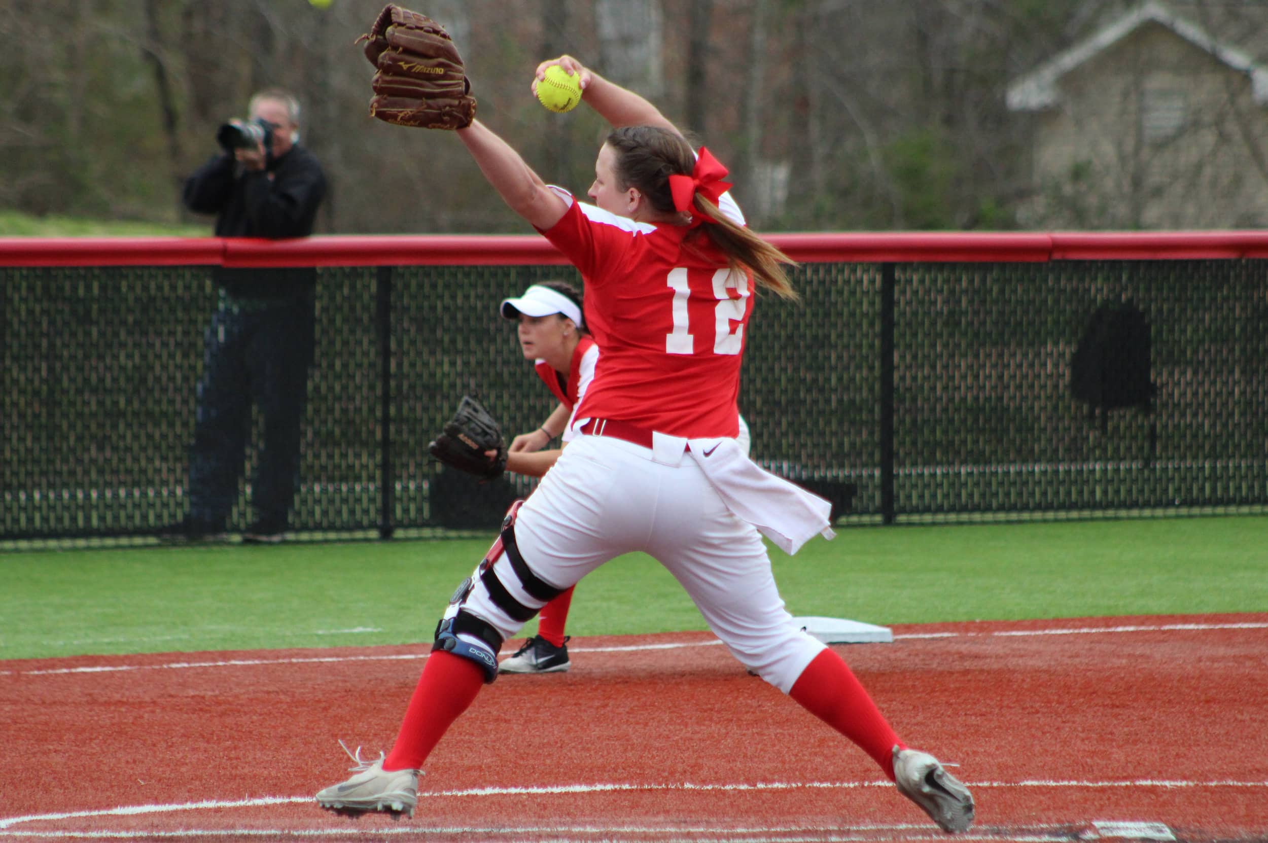 Junior, Marissa Tyndall, 12, pitches the softball.